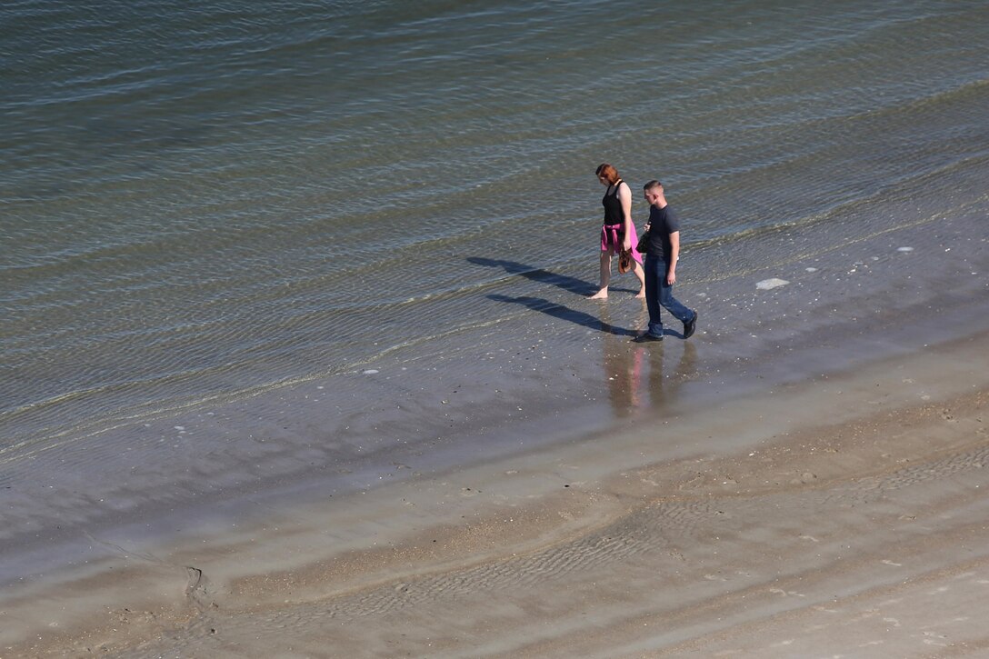 Service members and their guests explore the shores of Cape Lookout during the Military Fun Day at Cape Lookout Island, N.C., Oct. 9, 2015. The Carteret Military Affairs Committee hosted more than 80 service members and their guests during their visit to the Waterfowl Museum and Cape Lookout as a day of appreciation for service members and the dedication they uphold to their duties. 