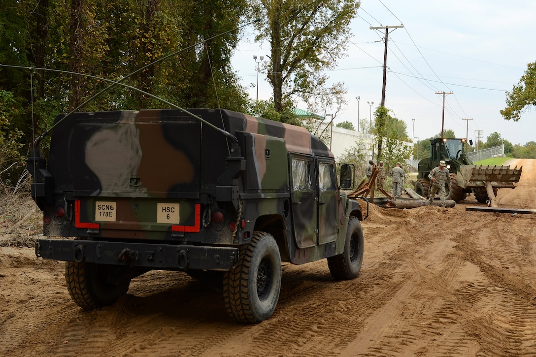 Guardsmen repair a section of Whitehouse Road affected by heavy rainfall in Columbia, S.C., Oct. 13, 2015. South Carolina Air National Guard photo by Senior Master Sgt. Edward Snyder