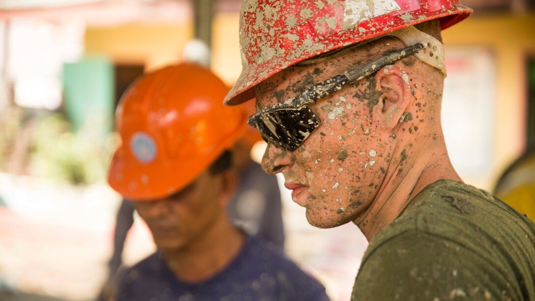 Cpl. Blake Ericksonworks together Philippine Navy Seabees, members of their naval construction battalions, to fill wheelbarrows with cement mix while working on the humanitarian civic assistance project at Binduyan Elementary School Oct. 4, during Amphibious Landing Exercise 2015 . PHIBLEX 15 is an annual, bilateral training exercise conducted by members of the Armed Forces of the Philippines alongside U.S. Marine and Navy Forces. It focuses on strengthening the partnership and relationships between the two nations across a range of military operations, including disaster relief and complex expeditionary operations. Erickson is a combat engineer with 9th Engineer Support Battalion, 3rd Marine Logistics Group, III Marine Expeditionary Force. 