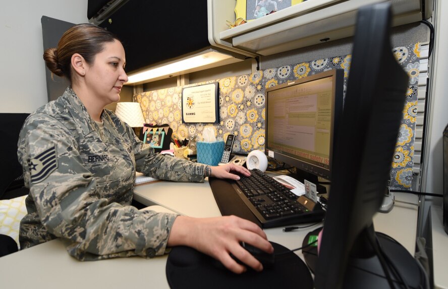 Tech. Sgt. Michelle Bernard verifies personnel training records Oct. 7, 2015, at the San Antonio Military Medical Center, Joint Base San Antonio-Fort Sam Houston. Bernard recently received the Air Education and Training Command 2015 Lance P. Sijan U.S Air Force Leadership Award in the junior enlisted category. She earned the award for her leadership and performance as the group unit training manager and 959th Medical Group Microbiology NCO in charge. (U.S. Air Force photo/Staff Sgt. Jerilyn Quintanilla)