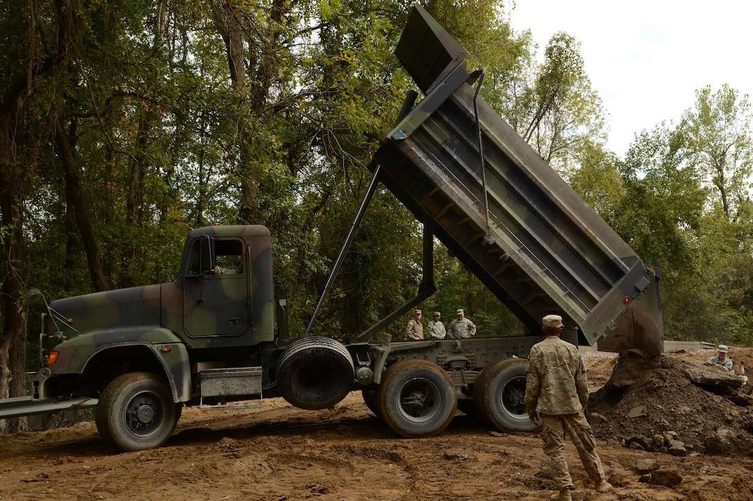 Guardsmen repair a section of Whitehouse Road affected by heavy rainfall in Columbia, S.C., Oct. 13, 2015. South Carolina Air National Guard photo by Senior Master Sgt. Edward Snyder