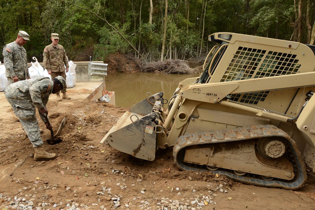 Guardsmen repair a section of Whitehouse Road affected by heavy rainfall in Columbia, S.C., Oct. 13, 2015. South Carolina Air National Guard photo by Senior Master Sgt. Edward Snyder