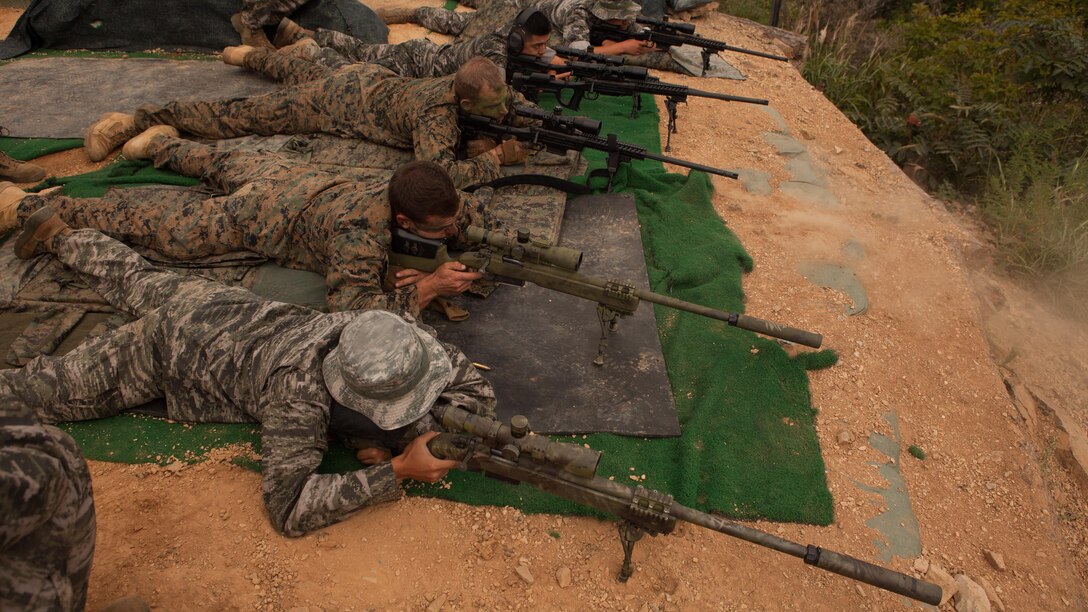 ROK and U.S. Marines fire at targets from 500 meters on the sniper range at Baengnyeongdo, Republic of Korea, Sept. 11, 2015. Marines from both countries exchanged training on weapon systems, methods of concealment, and other capabilities throughout the training. The exercise was part of Korean Marine Exchange Program 15-13, a bilateral training exercise that enhances the ROK and U.S. alliance, promotes stability on the Korean Peninsula, and strengthens ROK and U.S. military capabilities. The scout snipers are attached to Echo Company, 2nd Battalion, 3rd Marine Regiment, currently assigned to 4th Marine Regiment, 3rd Marine Division, III Marine Expeditionary Force, under the unit deployment program. The ROK Marines are with 6th Force Recon Company, 6th Brigade, 2nd ROK Marine Corps Division. 