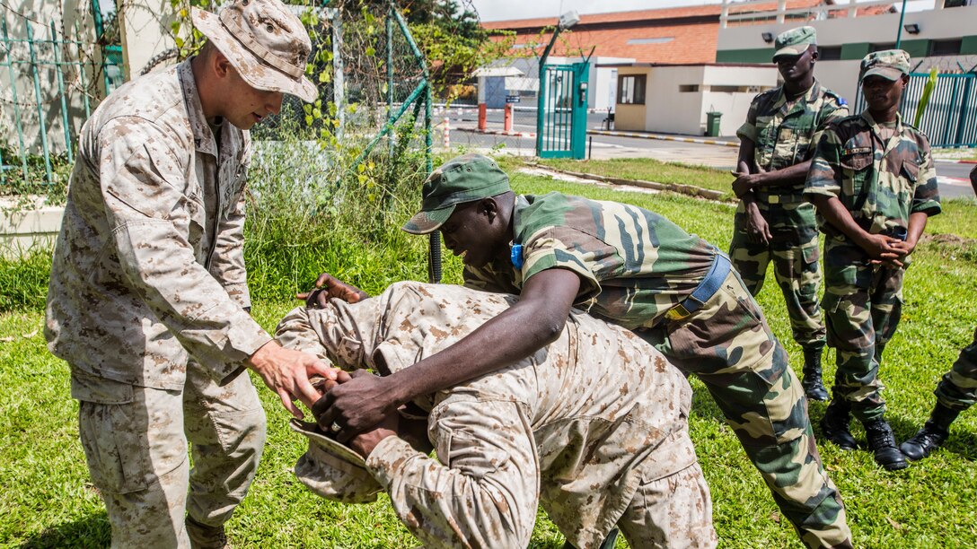 Senegalese military members practice personnel searches with U.S. Marines aboard Bel-Air military base, Sept. 21-22 in Dakar, Senegal. The Marines have participated in multiple training evolutions with the Senegalese military, which reinforces partnership between the two militaries. 
