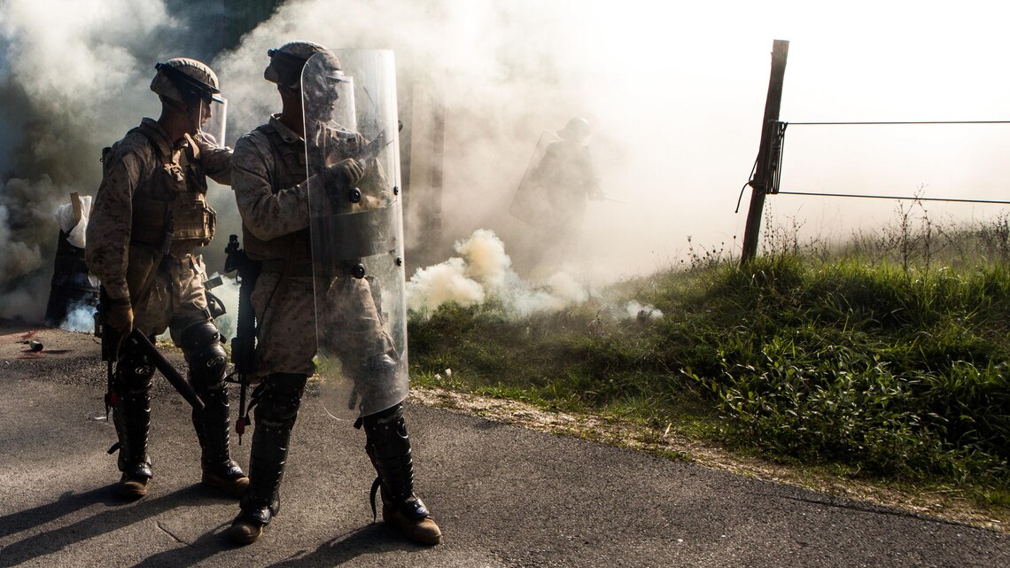 U.S. Marines stand guard during a simulated civilian evacuation at the National Gendarmerie Tactical Training Center in Saint-Astier, France, Oct. 9. The exercise marks the third rotation of Special-Purpose Marine Air-Ground Task Force Crisis Response-Africa Marines training alongside the Gendarmerie. 