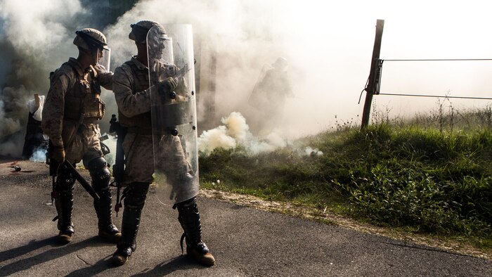 U.S. Marines stand guard during a simulated civilian evacuation at the National Gendarmerie Tactical Training Center in Saint-Astier, France, Oct. 9. The exercise marks the third rotation of Special-Purpose Marine Air-Ground Task Force Crisis Response-Africa Marines training alongside the Gendarmerie. 