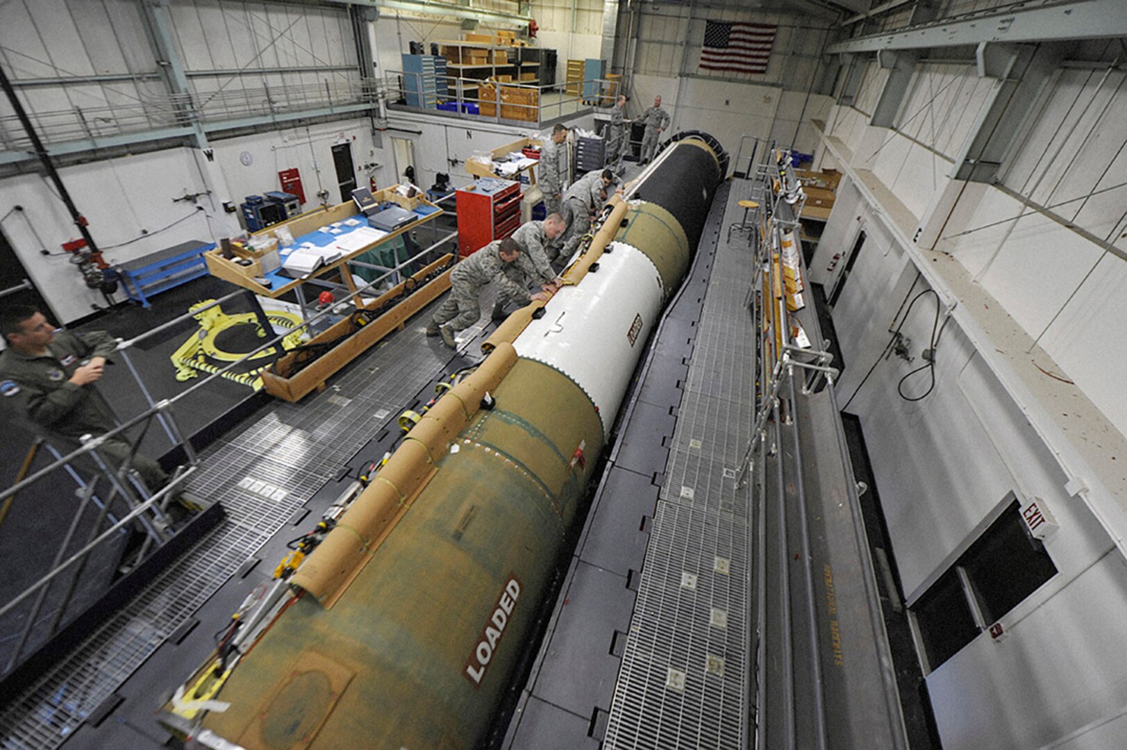 A 576th Flight Test Squadron Missile Handling Team installs a cable raceway on an Intercontinental Ballistic Missile at Vandenberg Air Force Base, California. DLA Aviation is working with the Air Force to improve its support of ICBM weapons systems. 