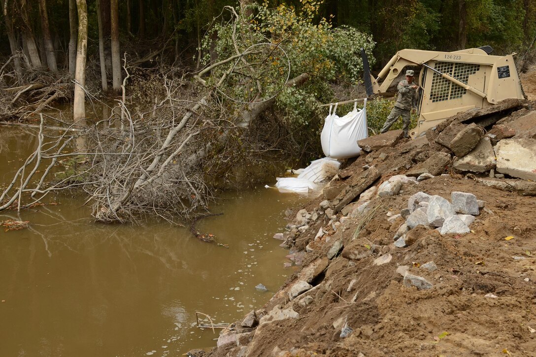 Guardsmen repair a section of Whitehouse Road affected by heavy rainfall in Columbia, S.C., Oct. 13, 2015. South Carolina Air National Guard photo by Senior Master Sgt. Edward Snyder 