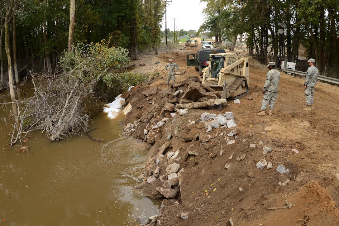 Guardsmen repair a section of Whitehouse Road affected by heavy rainfall in Columbia, S.C., Oct. 13, 2015. South Carolina Air National Guard photo by Senior Master Sgt. Edward Snyder