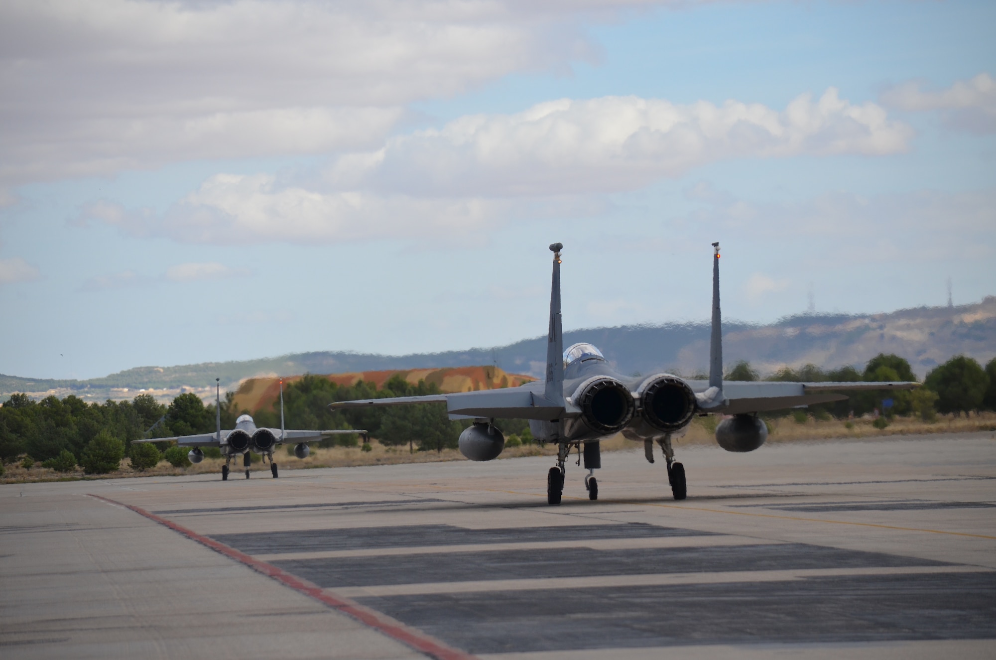 Crew members of the 48th Fight Wing prepare an F-15C Eagle for takeoff at the NATO Tactical Leadership Program in Albacete, Spain, Oct. 8, 2015. The program is a NATO mission commander’s school designed to provide multilateral training and increase interoperability amongst allied partners. (U.S. Air Force photo/Capt. Sybil Taunton)