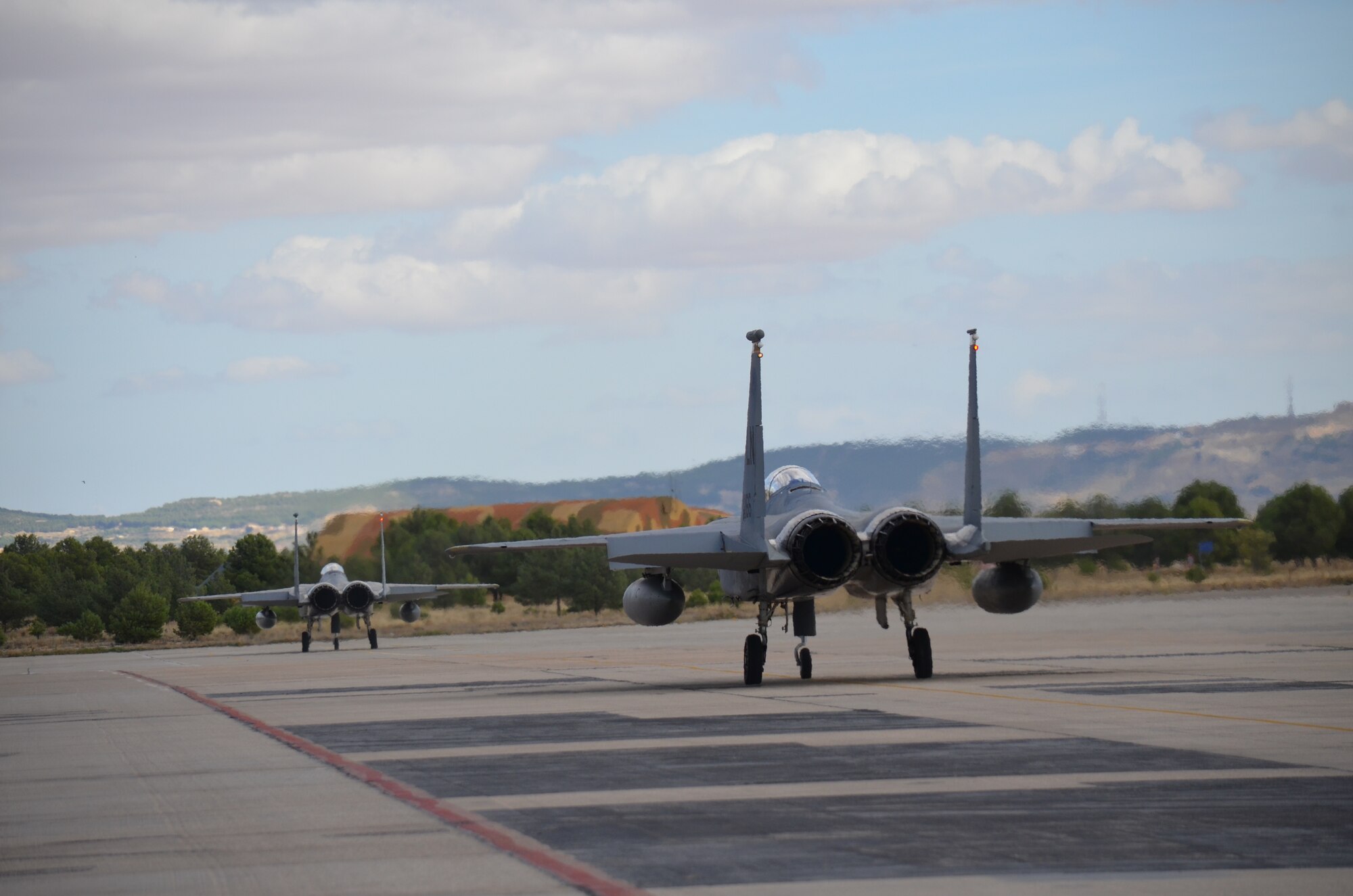 Crew members of the 48th Fight Wing prepare an F-15C Eagle for takeoff at the NATO Tactical Leadership Program in Albacete, Spain, Oct. 8, 2015. The program is a NATO mission commander’s school designed to provide multilateral training and increase interoperability amongst allied partners. (U.S. Air Force photo/Capt. Sybil Taunton)