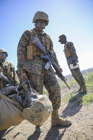 Recruit Hunter L. Blackston, Lima Company, 3rd Recruit Training Battalion, carries a simulated casualty during the Crucible at Edson Range, Marine Corps Base Camp Pendleton, Calif., Oct. 6. Blackston is a Plugerville, Texas, native and was recruited out of Recruiting Station Austin North, Texas.  Blackston lost 105 pounds in three months to be able to enter Marine Corps recruit training.  He motivated his friends and family to also lose weight and live a healthier lifestyle.  Today, all males recruited from west of the Mississippi are trained at MCRD San Diego. The depot is responsible for training more than 16,000 recruits annually. Lima Company graduated Oct. 16.  