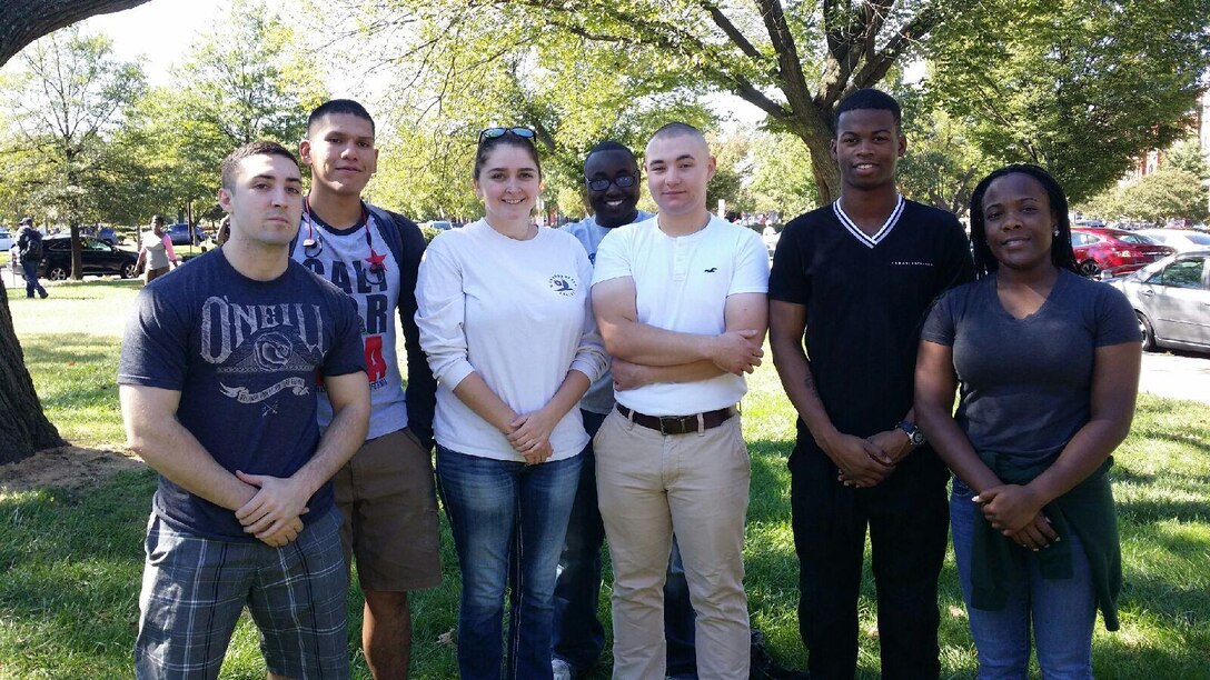 Marines from Marine Barracks Washington, D.C., pose for a photo during a community relations event, Oct. 11, 2015. The event started at the Barracks and the volunteers worked their way up to the corner of 6th and C Streets SE, while handing out “Blessing Bags” of food to the homeless and needy throughout the local community. Volunteering is a great opportunity to help those in need and positively impact our community. (U.S. Marine Corps photo by Cpl. Skye Davis/Released)