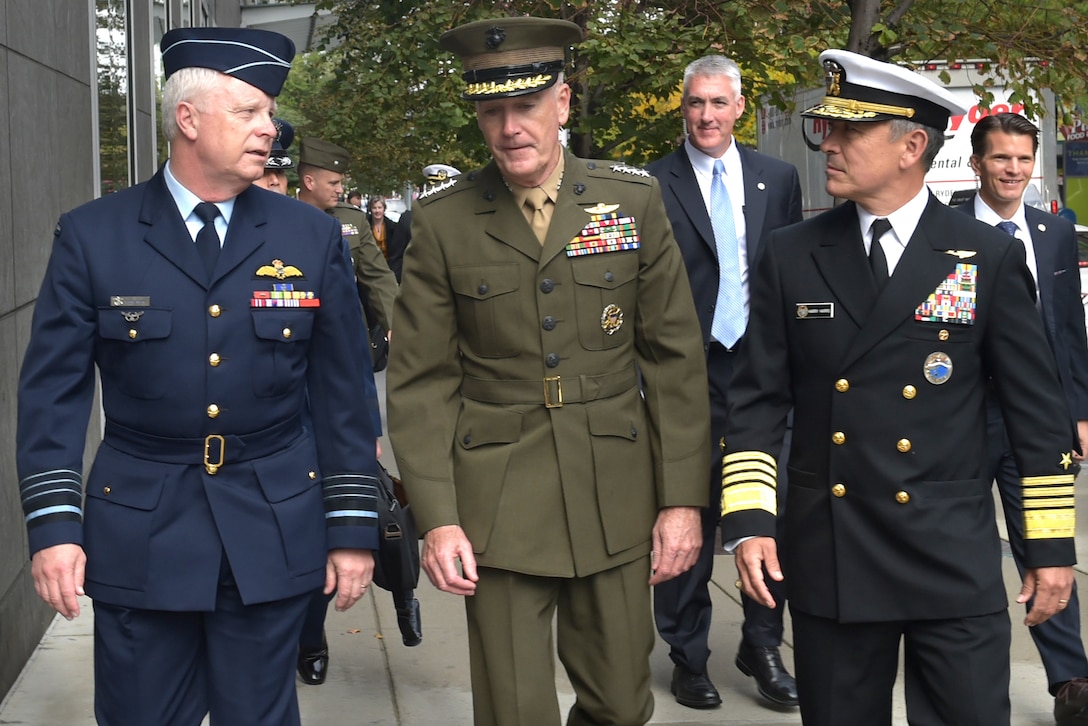 Foreground, from left, Air Chief Marshal Mark Binskin, chief of Australia's Defense Force; U.S. Marine Corps Gen. Joseph F. Dunford Jr., chairman of the Joint Chiefs of Staff; and U.S. Navy Adm. Harry Harris Jr., commander of U.S. Pacific Command, walk to their next meeting during the 2015 Australia-U.S. Ministerial Consultations in Boston, Oct. 13, 2015. DoD photo by D. Myles Cullen