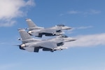 Two U.S. Air Force F-16 Fighting Falcons from the 120th Fighter Squadron, Colorado Air National Guard, fly together during a photo chase mission around Denver, May 29, 2015. 