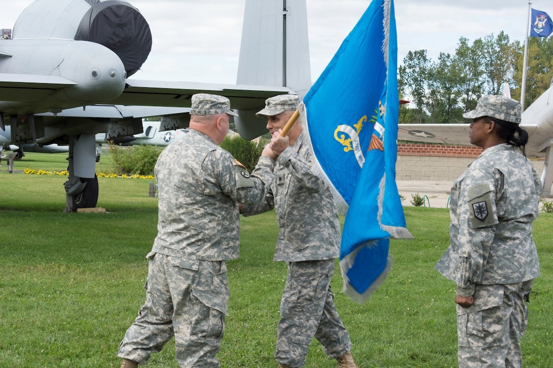 Soldiers of the 372nd Military Intelligence Battalion conduct an activation ceremony at the Selfridge Air National Guard museum on 12 Sept. The event symbolizes the Army tradition of recognizing the activation of a Army unit with a direct mission in support of the Department of Defense.  Col. Andrew Udzielak, Commander of the 648th Regional Support Group officiated the event, while the 338th Army Band entertained those in attendance.
