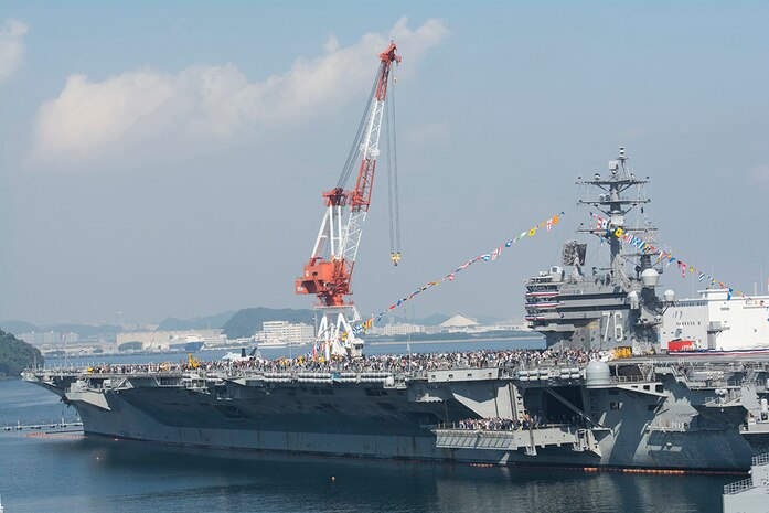YOKOSUKA, Japan (Oct. 12, 2015) - Guests tour the U.S. Navy's only forward-deployed aircraft carrier USS Ronald Reagan (CVN 76). Ronald Reagan and Carrier Air Wing (CVW) 5 provide a combat-ready force that protects and defends the collective maritime interests of its allies and partners in the Indo-Asia-Pacific region. 