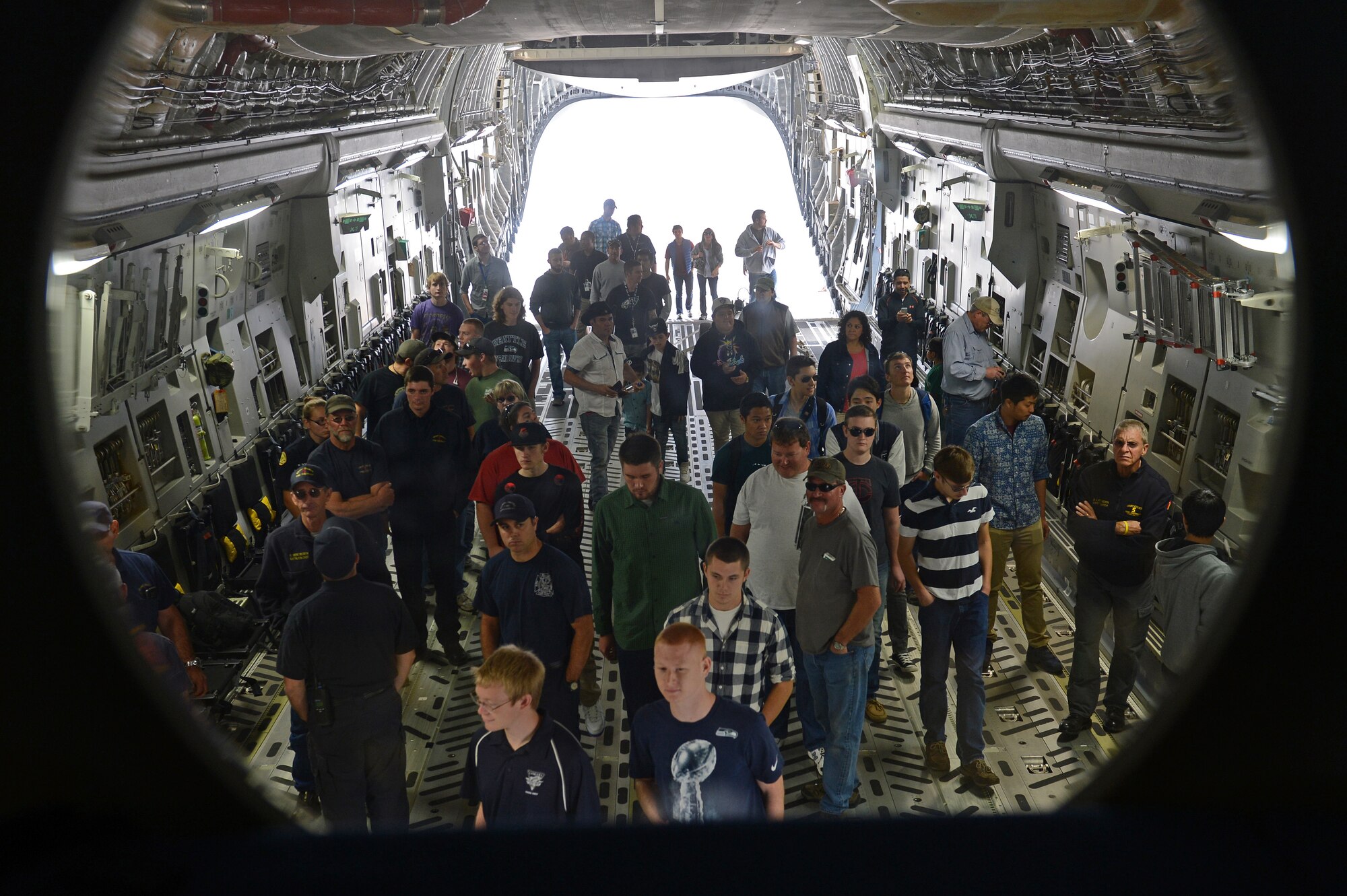 Students from Big Bend Community College and the Grant County fire department tour a C-17 Globemaster III at Moses Lake, Wash., Oct. 9, 2015. The students are enrolled into the BBCC Commercial Airline pilot program and progress through a rigorous two- year program that prepares them for a career as a professional pilot. During the program, students will get to fly commercial jets, helicopters, and cessna’s. (U.S. Air Force photo/Senior Airman Divine Cox)