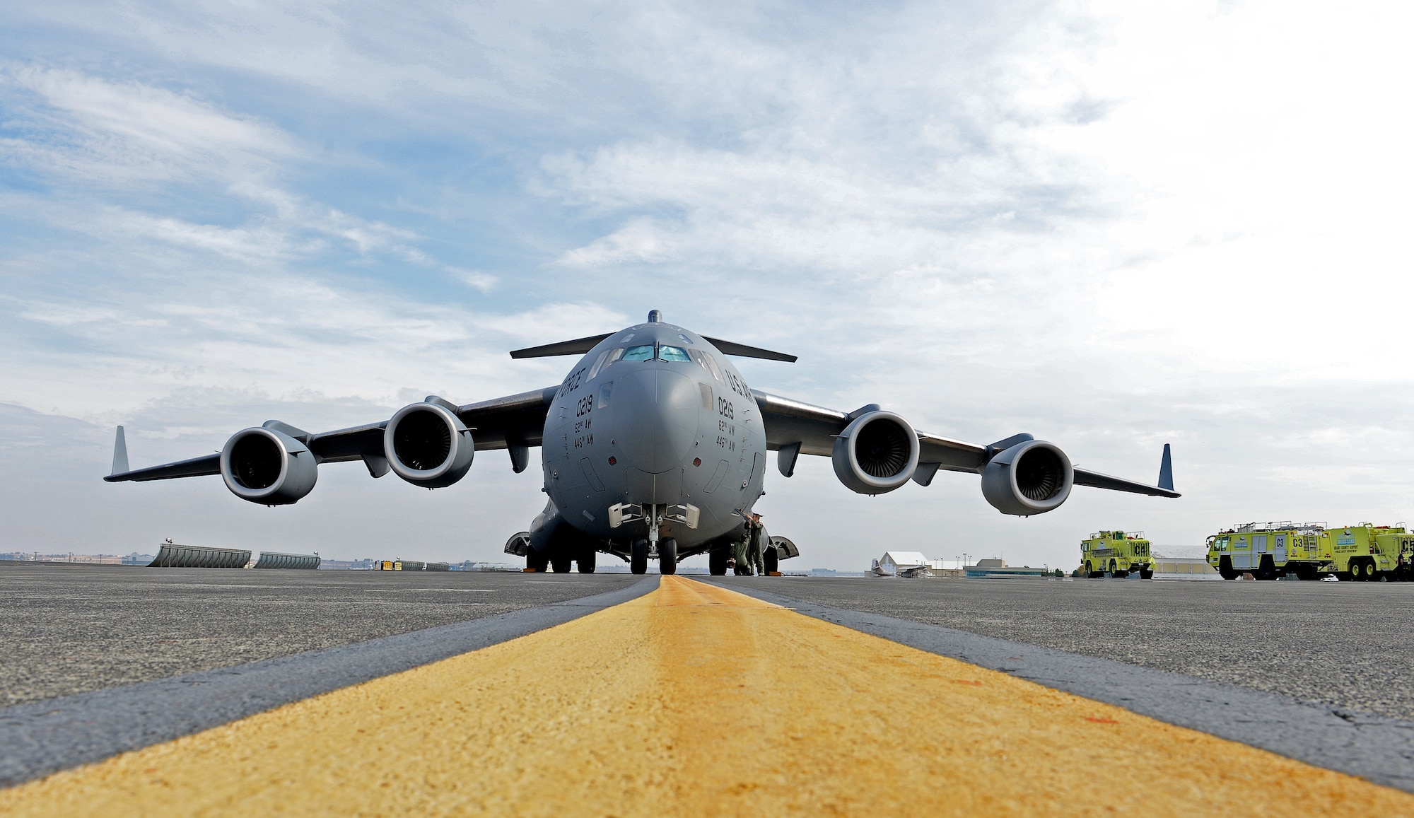 A C-17 Globemaster III sits on the runway at Grant County International Airport, during a C-17 aircraft tour at Moses Lake, Wash., Oct. 9, 2015. During the tour, students from Big Bend Community College and the Grant County fire department were allowed to tour the aircraft, see the flight deck, and ask the flight crew questions about the aircraft. (U.S. Air Force photo/Senior Airman Divine Cox)