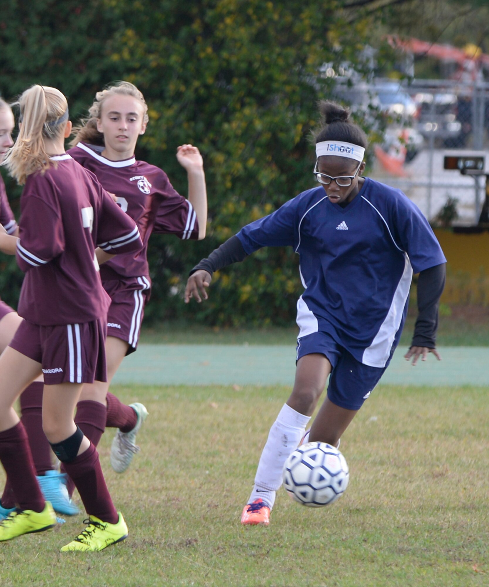 Marcia Green-Williams, right, a member of the Hanscom Middle School Falcons girls’ soccer team, dribbles the ball during a home match against the Westford Middle School team at the base track Oct. 14. The Hanscom Middle School team lost the game by a score of 4 to 0. (U.S. Air Force photo by Mark Wyatt)