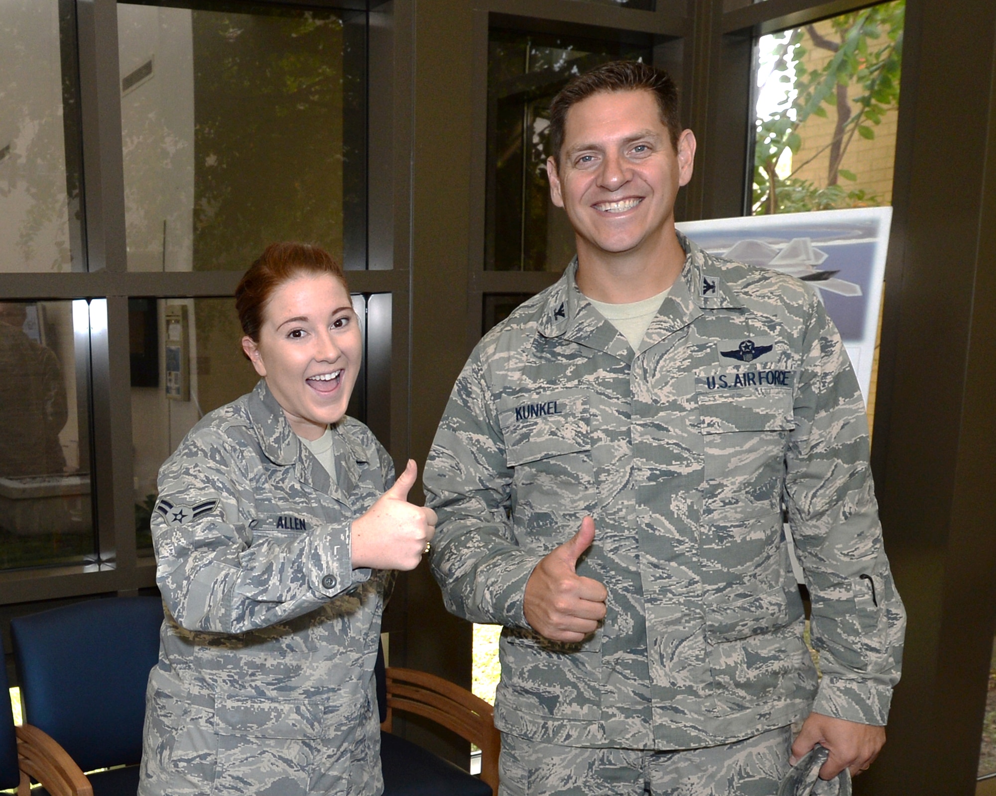 Colonel Joseph D. Kunkel, 325th Fighter Wing vice commander, poses with Airman 1st Class Dana Allen, a 325th Medical Group aerospace medical technician, during a tour of the 325th MDG.  Kunkel has put an emphasis on being involved with many of the Airmen at Tyndall and ensuring they have positive attitudes and experiences in the U.S. Air Force.  (U.S. Air Force photo by Airman 1st Class Cody R. Miller/Released)