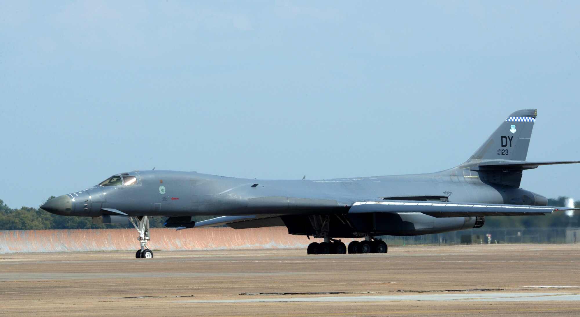 A B-1 Lancer taxis to the runway for takeoff at Barksdale Air Force Base, La., Oct. 8, 2015. Aircrew from the 7th Bomb Wing, Dyess AFB, Texas, ferried the aircraft here for 77th Weapons Squadron students and instructors to fly in the live-fly portion of a cruise missile integration exercise. The exercise aimed to achieve two specific objectives. The first was to educate weapons school students on cruise missile employment considerations and existing processes for planning and integrating cruise missiles. The second was to advance the development those planning processes in an attempt to make cruise missile attacks more effective and more efficient against a modern adversary. (U.S. Air Force photo/Airman 1st Class Curt Beach) 