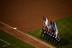 The Sheppard Air Force Base Honor Guard exit the field after the opening ceremonies of game three of the American League Division Series where the Texas Rangers hosted the Toronto Blue Jays at Globe ,Life Park in Arlington, Texas, Oct. 11, 2015. The flag in the outfield is handled by more than 125 joint service members stationed in Texas. The Blue Jays beat the Rangers 5-1. (U.S. Air Force photo/Senior Airman Robert McIlrath). 