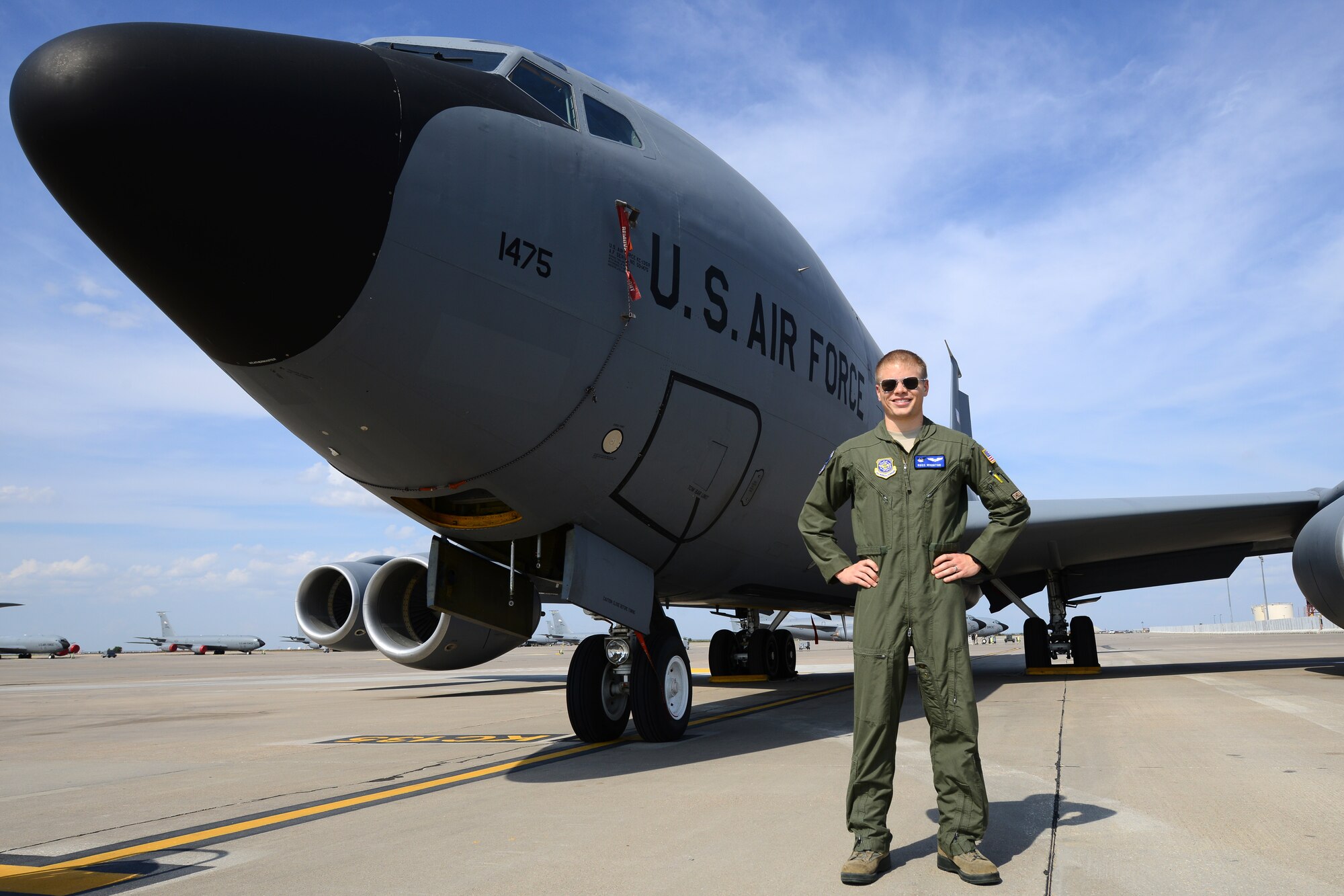 Second Lt. Justin Ross Wiginton, 344th Air Refueling Squadron navigator, poses next to a KC-135 Stratotanker, Oct. 8, 2015. Ross was chosen throughout the Air Mobility Command for the 2015 Gen. Robert “Dutch” Huyser Navigator Award because of his tactical expertise and how well he has executed missions. (U.S. Air Force photo by Airman 1st Class Christopher Thornbury)