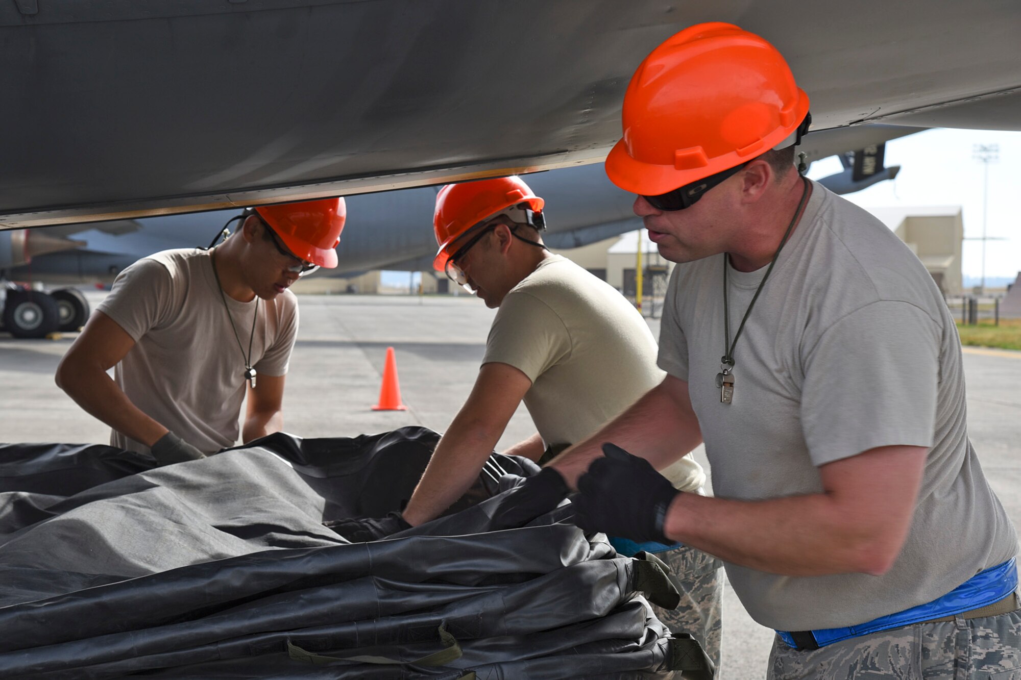 92nd Maintenance Squadron Airmen stack airbags in preparation for a Crash, Damaged, Disabled Aircraft lift Oct. 9, 2015, at Fairchild Air Force Base, Wash. The CDDAR training utilized AMS 26-type airbags. These airbags can support approximately 26 tons per bag.   (U.S. Air Force photo/Airman 1st Class Mackenzie Richardson)