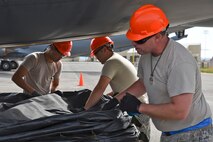 92nd Maintenance Squadron Airmen stack airbags in preparation for a Crash, Damaged, Disabled Aircraft lift Oct. 9, 2015, at Fairchild Air Force Base, Wash. The CDDAR training utilized AMS 26-type airbags. These airbags can support approximately 26 tons per bag.   (U.S. Air Force photo/Airman 1st Class Mackenzie Richardson)