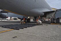 92nd Maintenance Squadron Airmen lay out synthetic dunnage in preparation for a Crash, Damaged, Disabled Aircraft Recovery training lift Oct. 9, 2015, at Fairchild Air Force Base, Wash. Airmen created platforms using synthetic dunnage in four separate locations under the aircraft. The platforms were of various heights, depending on the section of the aircraft they supported. After the platforms were constructed, the team then laid pallets and finally airbags on top of the platforms.  (U.S. Air Force photo/Airman 1st Class Mackenzie Richardson)