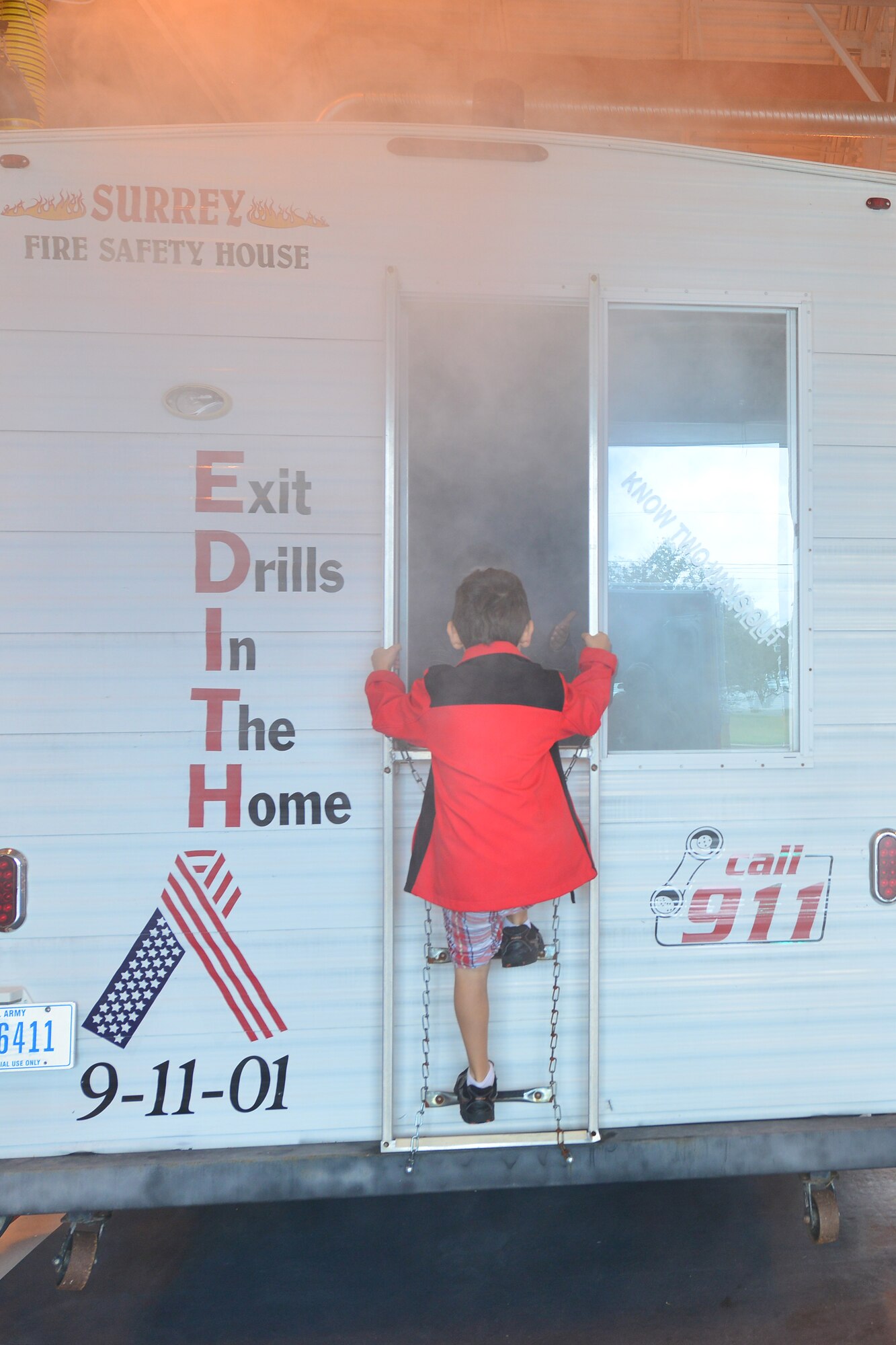 Children go through the fire safety house at Fort Eustis, Va., Oct. 10, 2015. The safety house was featured at the department’s open house as part of Fire Prevention Week. (U.S. Air Force photo by Staff Sgt. Natasha Stannard/Released)