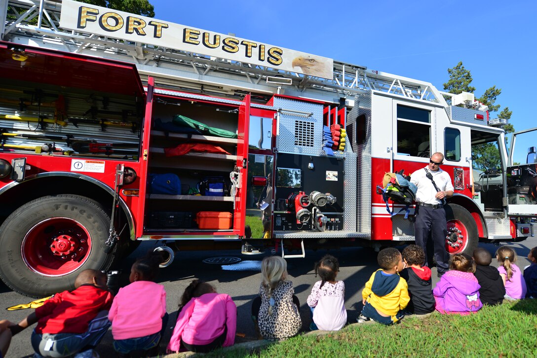 Matthew Blodgent, Fort Eustis Fire Department station chief, visits the child development center students at Fort Eustis, Va., Oct. 8, 2015. Blodgent covered the department’s practices and capabilities as part of a familiarization and safety presentation. (U.S. Air Force photo by Staff Sgt. Natasha Stannard/Released)