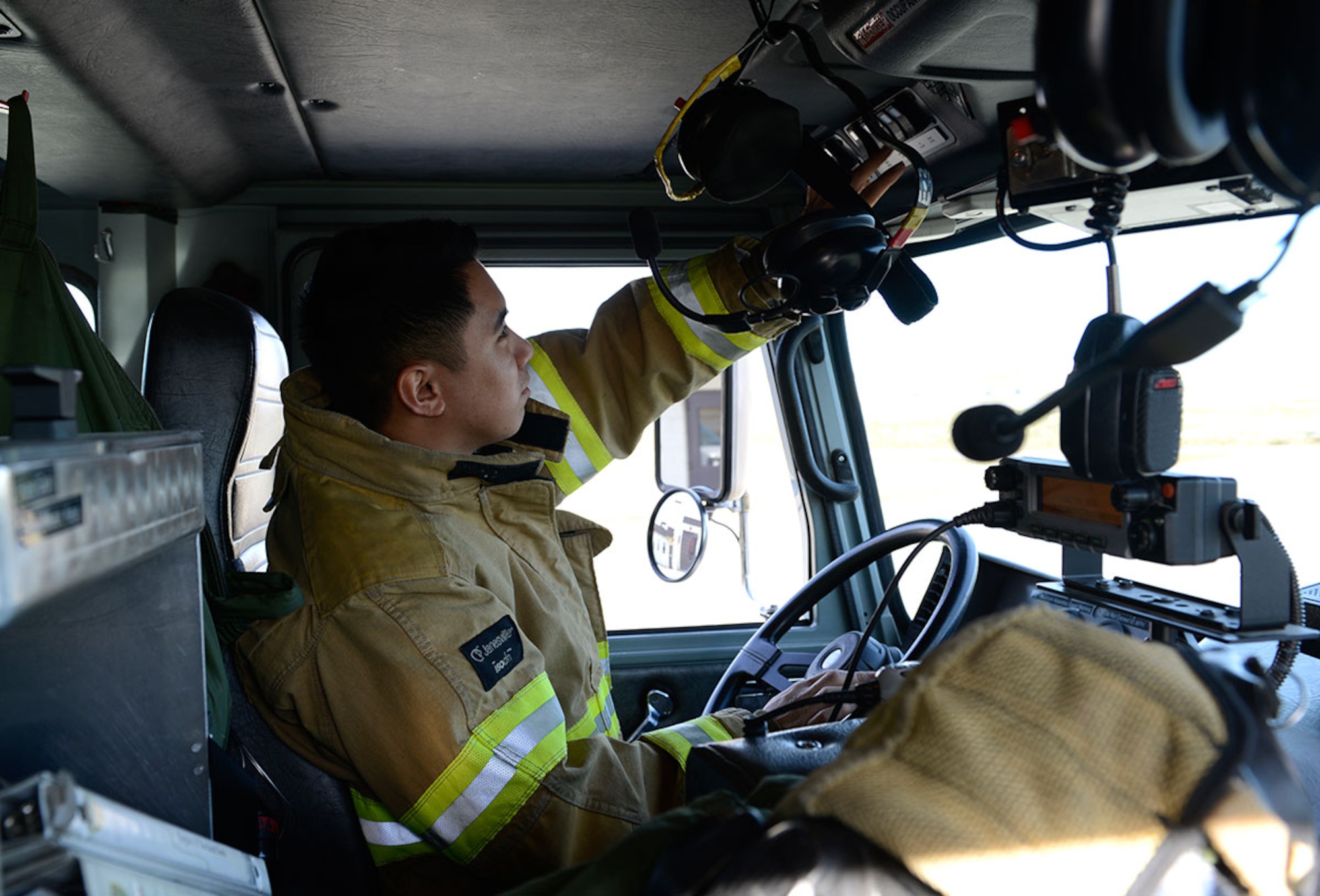 Garcia checks equipment on a fire truck on Oct. 1. Firefighters check equipment first thing every morning to ensure they are prepared for any and every emergency.  (U.S. Air Force photo/Airman Valerie Monroy)
