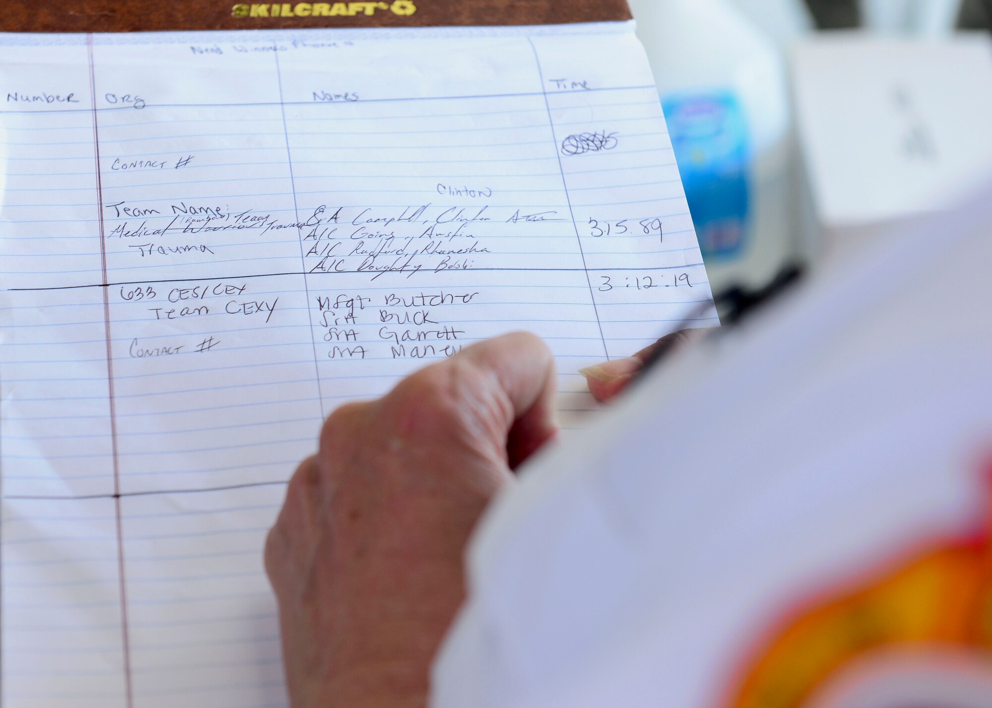 A U.S. Air Force firefighter reviews team timings during the Firefighter Challenge at Langley Air Force Base, Va., Oct. 9, 2015. The theme for fire prevention week 2015 is “Hear the beep where you sleep: Every bedroom needs a working fire alarm."(U.S. Air Force photo by Airman 1st Class Derek Seifert/ Released)