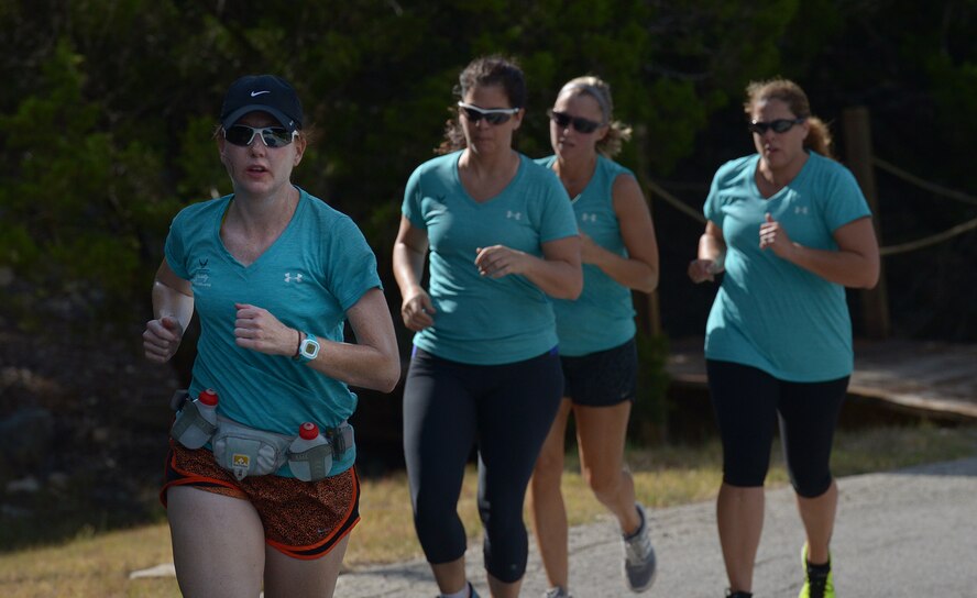 Team Barksdale spouses participate in the 6-mile run portion of the Rambler 120 at Joint Base San Antonio-Randolph Recreation Park at Canyon Lake Sept. 19, 2015. The eight-person team was the first from Barksdale to participate in the competition and earned first place in the all-female relay. (U.S. Air Force photo/ Johnny Saldivar)