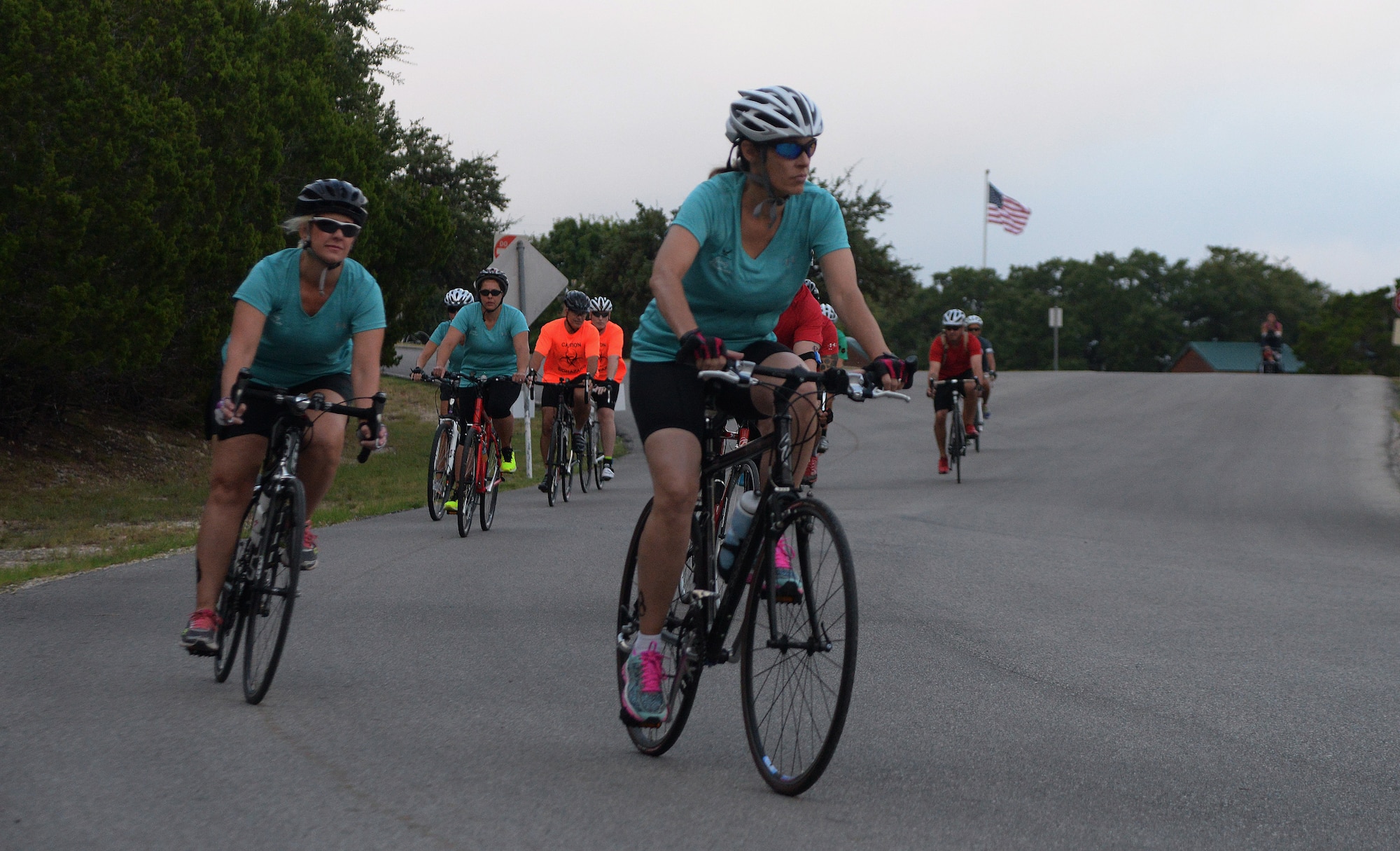 Team Barksdale spouses race a 22-mile bike route during the Rambler 120 at Joint Base San Antonio-Randolph Recreation Park at Canyon Lake Sept. 19, 2015. The Rambler 120 features four and eight-person teams competing in events to include a 22-mile bike race, 6-mile run, 2-mile raft race and a mystery event. (U.S. Air Force photo/Senior Airman Alexandria Slade)