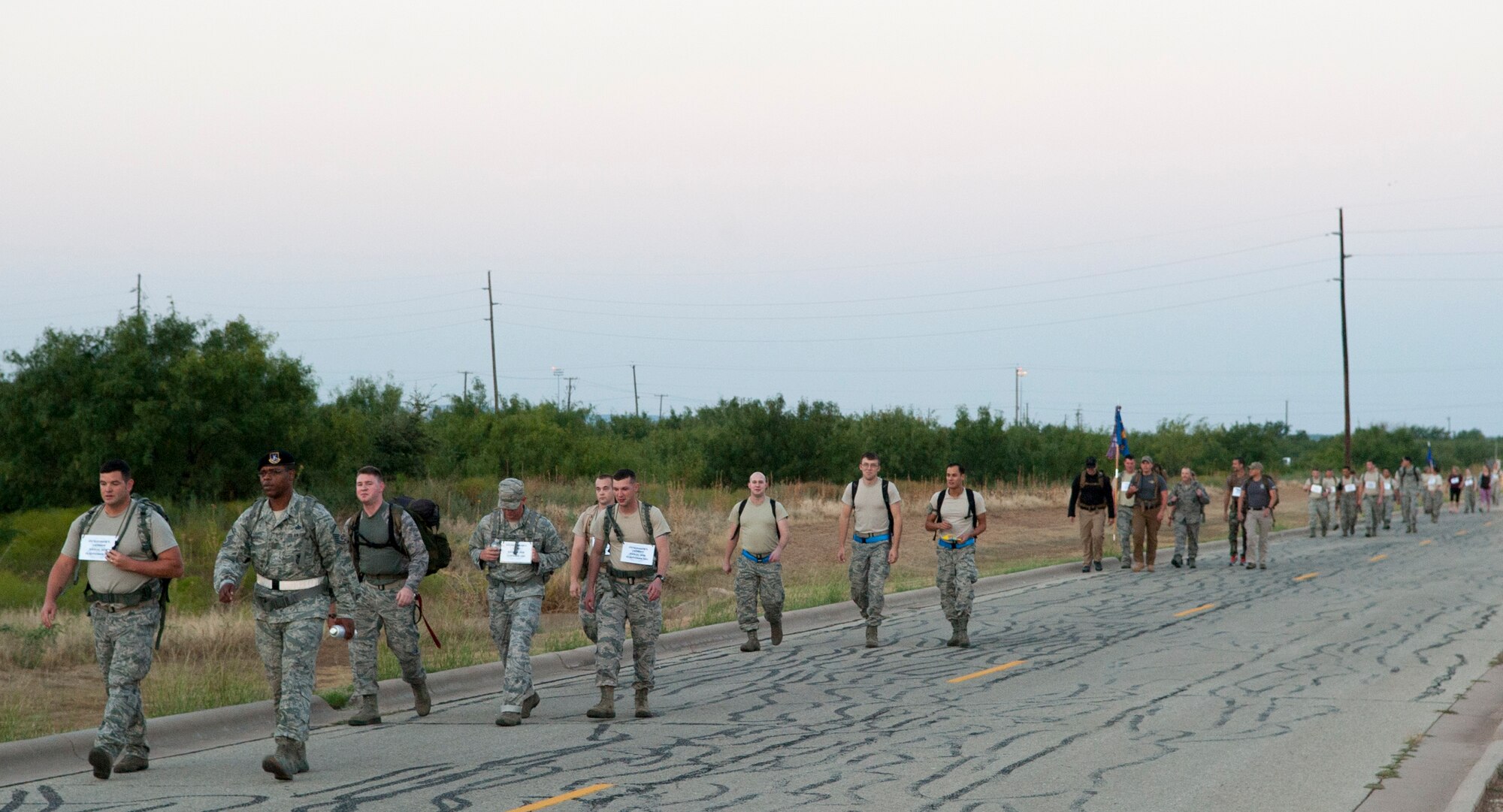 Dyess Airmen participate in a ruck march Sept. 30, 2015, at Dyess Air Force Base, Texas. The Ruck to Remember was a 5.5-mile march around base to memorialize the security forces members who made the ultimate sacrifice for their country. The event has been held every year for the past six years. (U.S. Air Force photo by Airman 1st Class Austin Mayfield/Released)