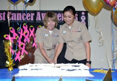 Navy Capt. Jane French, Naval Health Clinic Charleston senior nurse executive (Left) and Hospitalman Recruit Brandy Sandova, general hospital corpsman, cut the cake during NHCC's celebration of the Navy's 240th birthday Oct. 13 at the clinic. (Navy photo/ Kris Patterson)