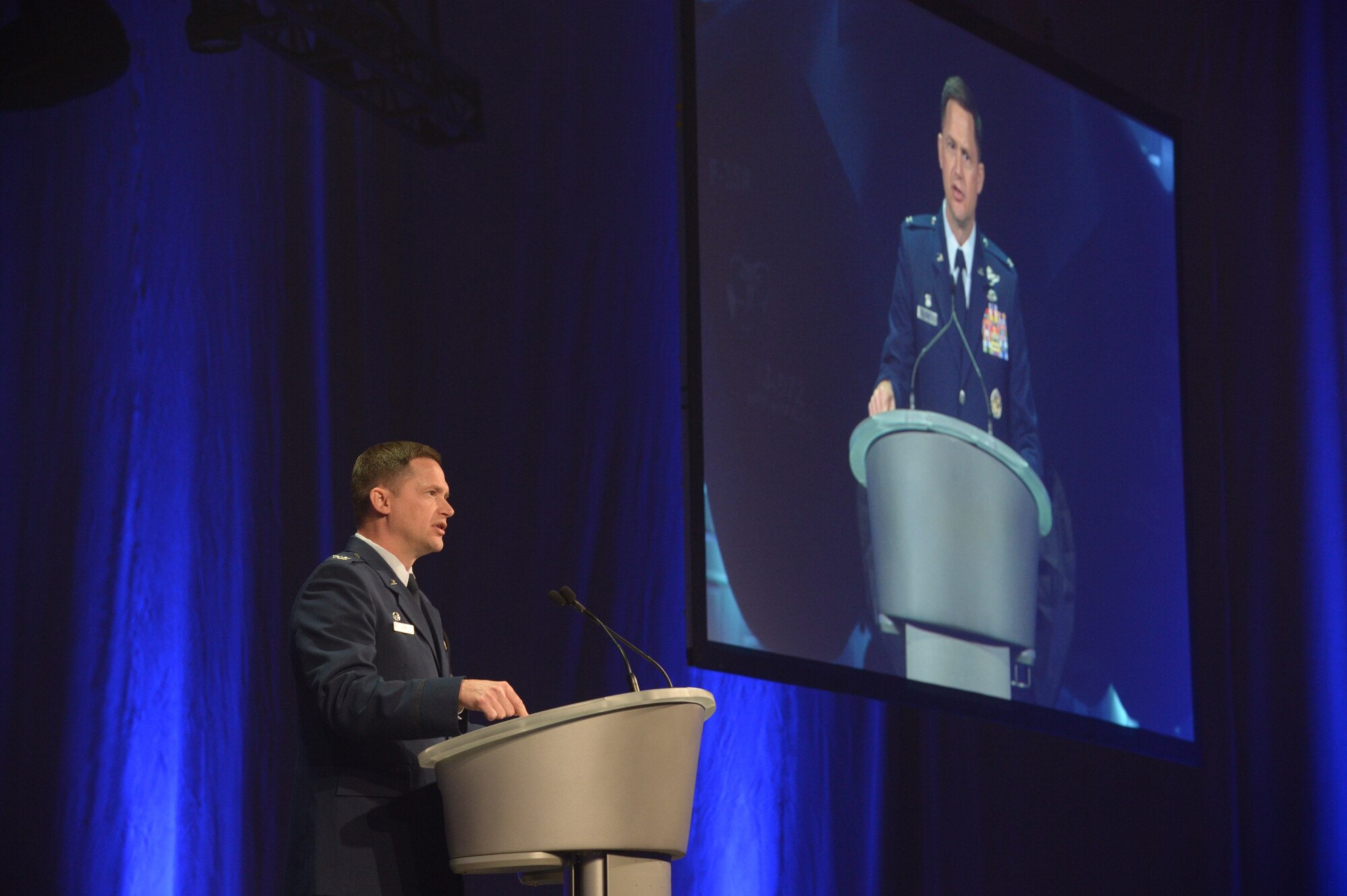 Col. David Lyons, 388th Fighter Wing commander, speaks to dignitaries and base personnel during an F-35A Lightning II aircraft unveiling ceremony Oct. 14 at Hill Air Force Base, Utah. Lyons and other military leaders thanked Utah representatives and community partners for their role in bringing the state-of-the-art, fifth generation fighter to Hill. (U.S. Air Force photo by Alex R. Lloyd/Released)