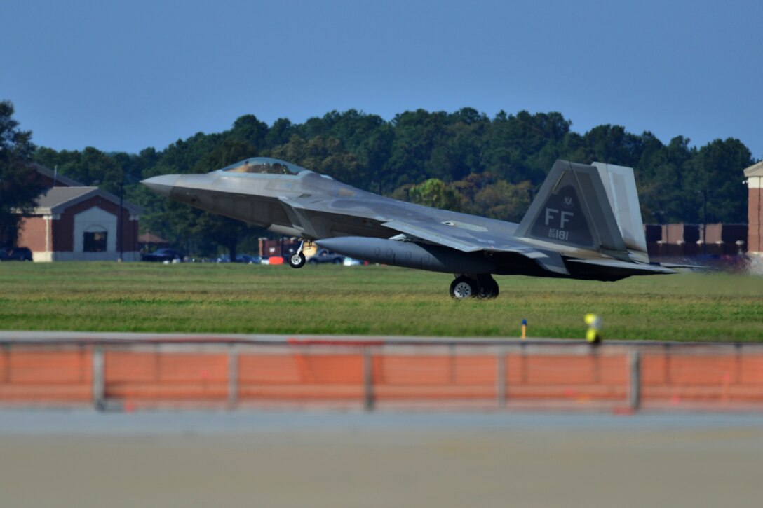 An F-22 Raptor lands at Langley Air Force Base, Va., Oct. 9, 2015. The 1st and 192nd Fighter Wings’ were returning from a deployment to the Middle East in support of Operation Inherent Resolve. (U.S. Air Force photo by Staff Sgt. Natasha Stannard/Released)