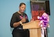 Lawanna Barron, 23d Medical Operations Squadron Family Advocacy outreach manager, speaks about her experience as a three-year breast cancer survivor during the Breast Cancer and Domestic Violence Awareness luncheon, Oct. 8, 2015, at Moody Air Force Base, Ga. One in eight women in the U.S. will develop invasive breast cancer in their lifetime. (U.S. Air Force photo by Airman 1st Class Greg Nash/Released) 