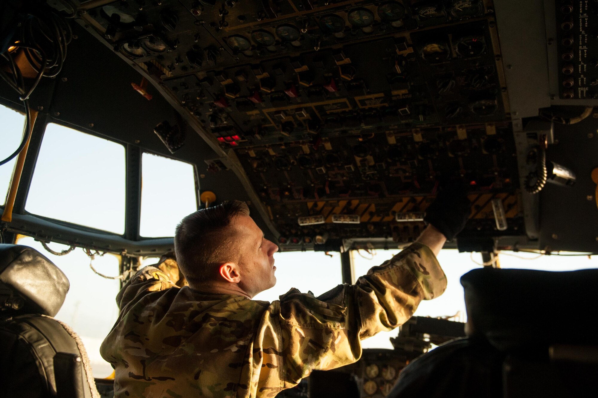 U.S. Air Force Tech. Sgt. John Rorie, 41st Expeditionary Electronic Combat Squadron flight engineer, completes a post flight inspection on an EC-130H Compass Call aircraft at Bagram Air Field, Afghanistan, Sept. 6, 2015. The Compass Call is an airborne tactical weapon system using a heavily modified version of the C-130 Hercules airframe. (U.S. Air Force photo by Tech. Sgt. Joseph Swafford/Released)
