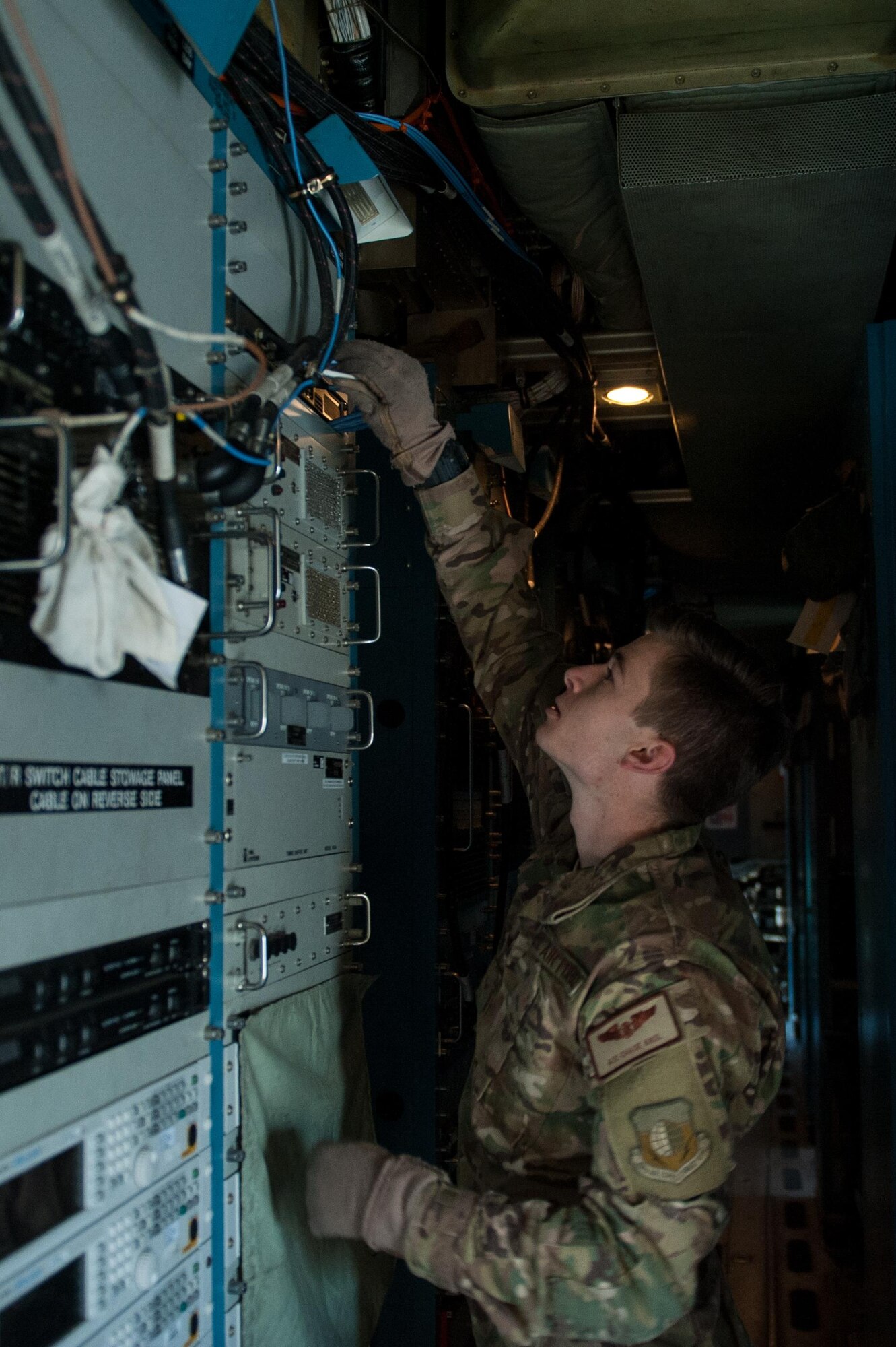U.S. Air Force Airman 1st Class Chase Krol, 41st Expeditionary Electronic Combat Squadron airborne maintenance technician, completes a post-flight inspection on an EC-130H Compass Call aircraft at Bagram Air Field, Afghanistan, Sept. 6, 2015. The Compass Call is an airborne tactical weapon system using a heavily modified version of the C-130 Hercules airframe. (U.S. Air Force photo by Tech. Sgt. Joseph Swafford/Released)