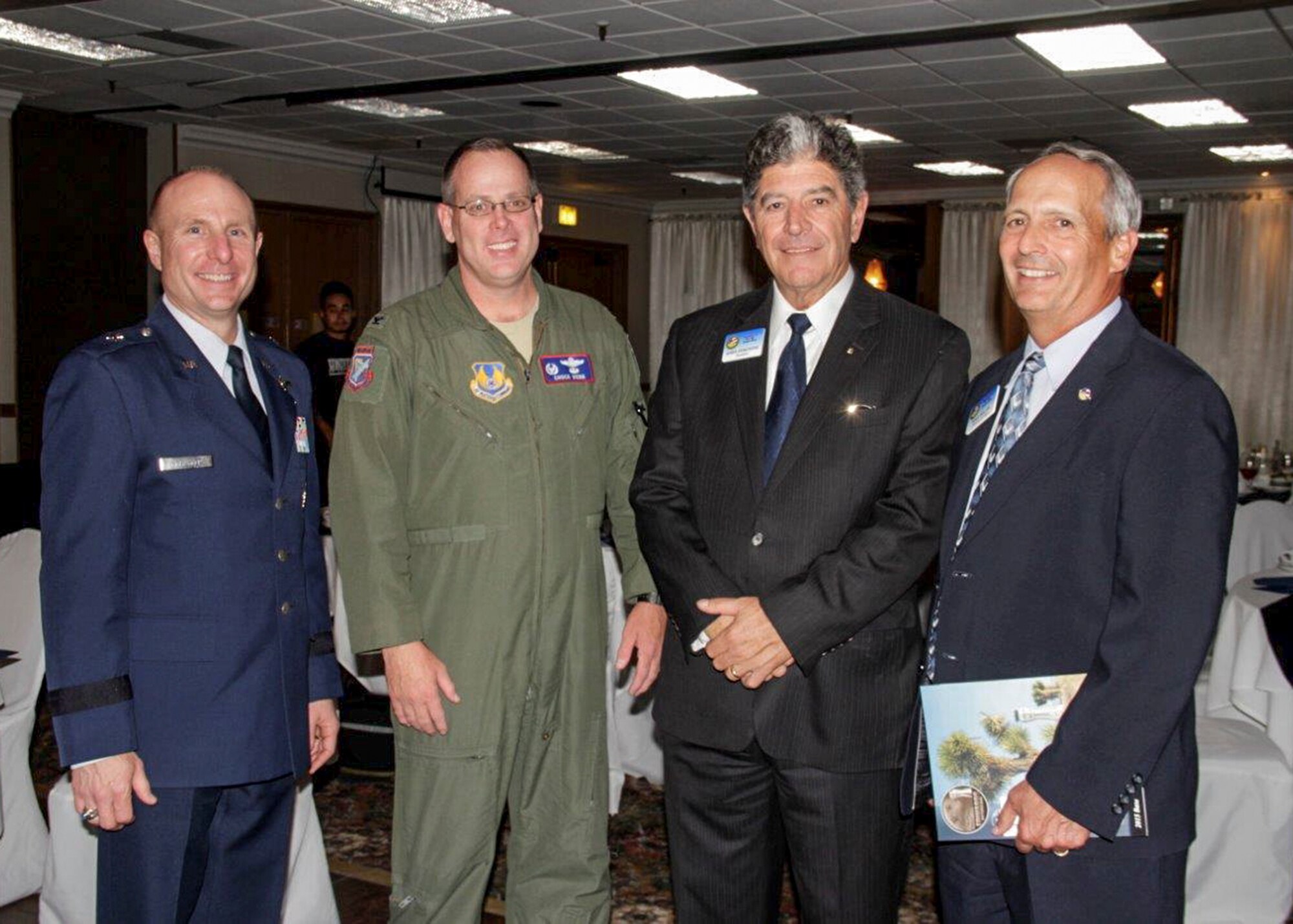 Left to right: Brig. Gen. Carl Schaefer, 412th Test Wing commander, and Col. Charles Webb, U.S. Air Force Test Pilot School commandant, pose for a photo with Edwards AFB Civ-Mil president John Fergione and Michael Belzil. The four participated in the 2015-2016 Civ-Mil installation dinner where new members were introduced. The group donated over $29,000 to help support Airmen stationed at Edwards AFB. (Courtesy photo by Linda K.C. Reynolds)
