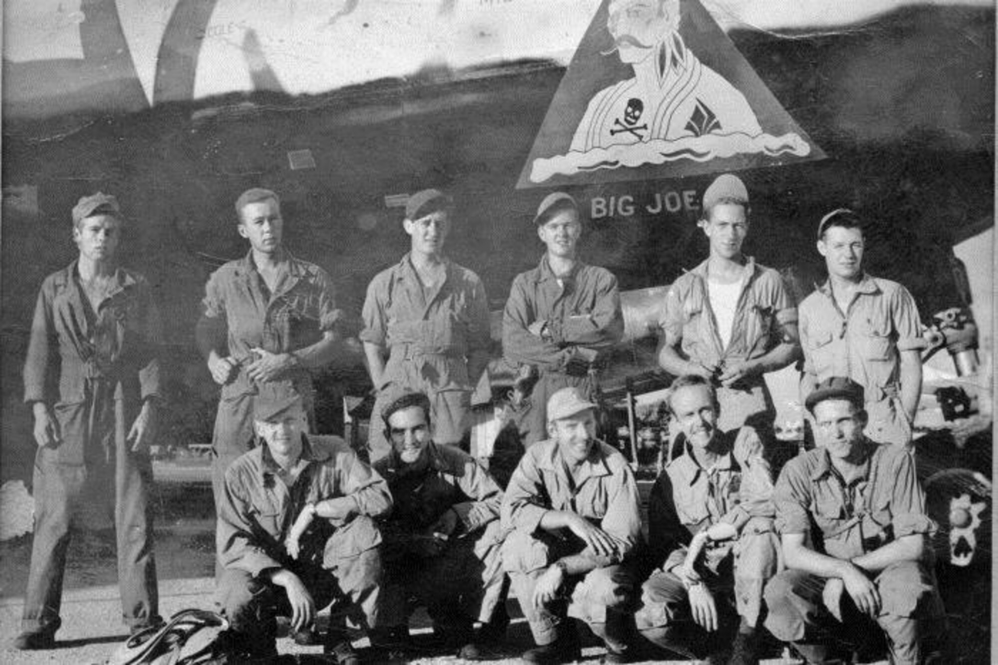 Co-historian David Wilson’s father, Sgt. Bernard E. Wilson, was a left gunner the 24th Bomb Squadron’s in the Howett crew of Crew # 2404.  The crew’s first missions were flown in “Big Joe,” with an experienced Aircraft Commander, pictured with them here, and then later they all flew in “Anonymous IV.”  Standing, from left to right, are Sgt. Bernard E. Wilson (Left Gunner), Cpl. Jack B. Denny (Right Gunner), Cpl. Marion L. Long (Tail Gunner), Sgt. Malcolm W. Douglas (Flight Engineer), S/Sgt. Raymond E. Raetz (Central Fire Control Gunner), Sgt. James C. Bishop (Radio Operator).  
Kneeling, from left to right are 2nd Lt. Phillip R. Pilling (Radar Operator), 2nd Lt. Charles E. Pickett (Bombardier), 1st Lt. Claude A. Johnstone (Aircraft Commander of “Big Joe”), 1st Lt. John C. Howett (Pilot), 2nd Lt. James H. Aiman (Navigator).  (Courtesy Mr. David Wilson, via 6th Bomb Group Association)

