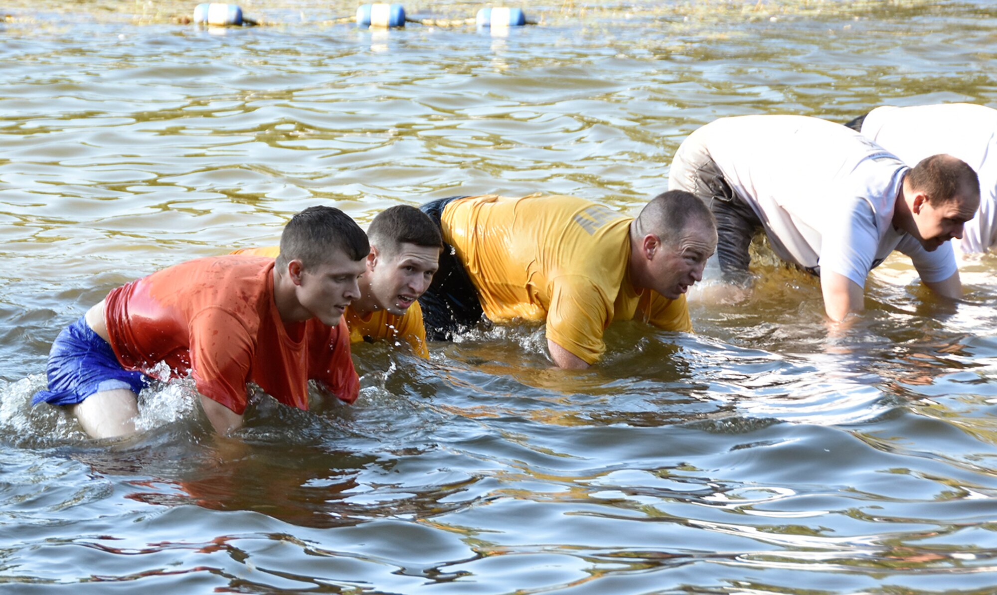 AEDC military personnel participated in the Air Force Team Cohesion Challenge program designed to teach leadership, promote unit cohesion and inspire teams to perform their best. Throughout the event participants wore a backpack filled with 30 to 40 pounds of equipment while completing military-inspired challenges and missions, such as basic training calisthenics, swimming, lifting and marching. (Photos by Jacqueline Cowan)