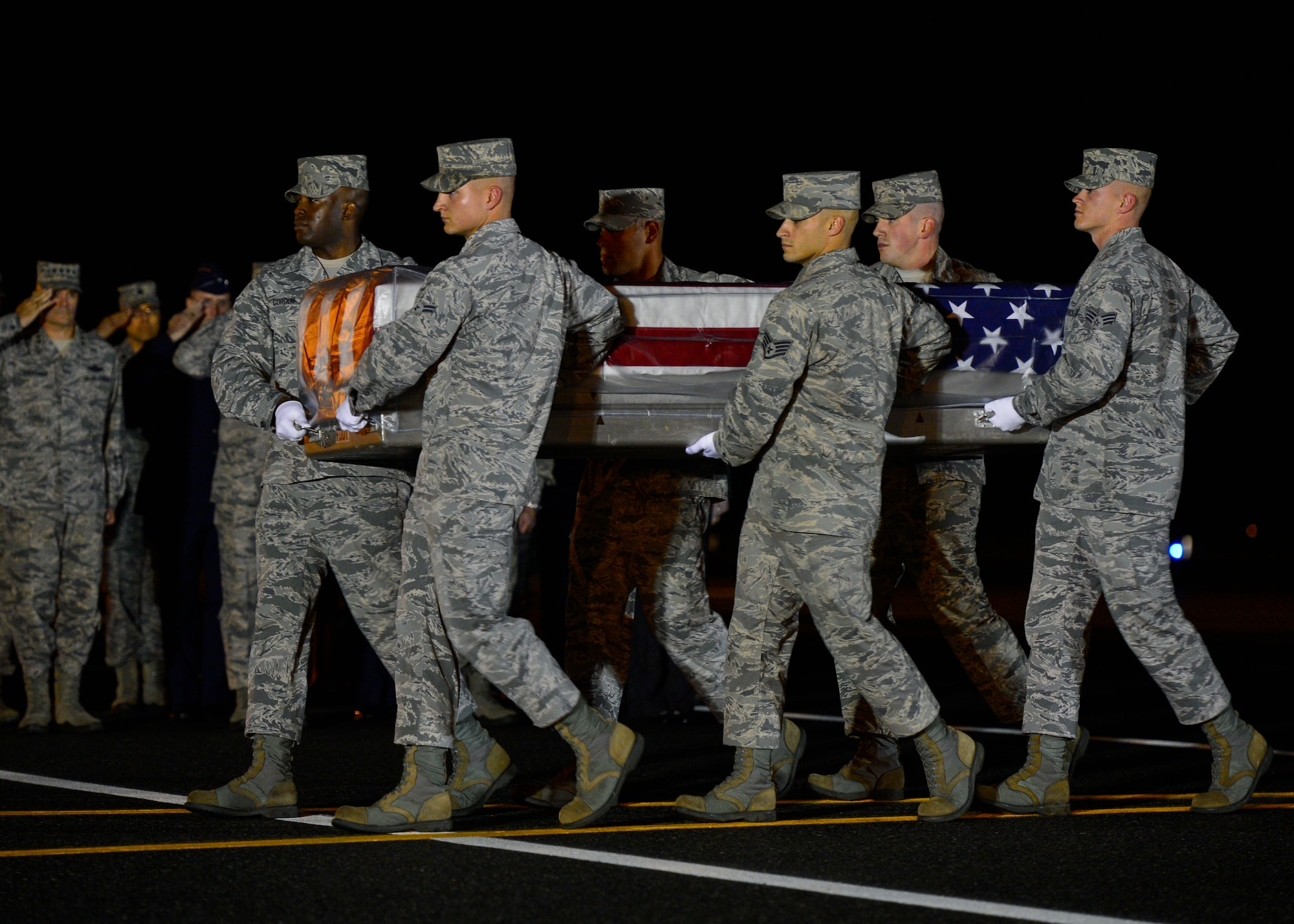 A U.S. Air Force carry team transfers the remains of U.S. Air Force Maj. Phyllis J. Pelky during a dignified transfer Oct. 13, 2015, at Dover Air Force Base, Del. (U.S. Air Force photo/Senior Airman Zachary Cacicia)
