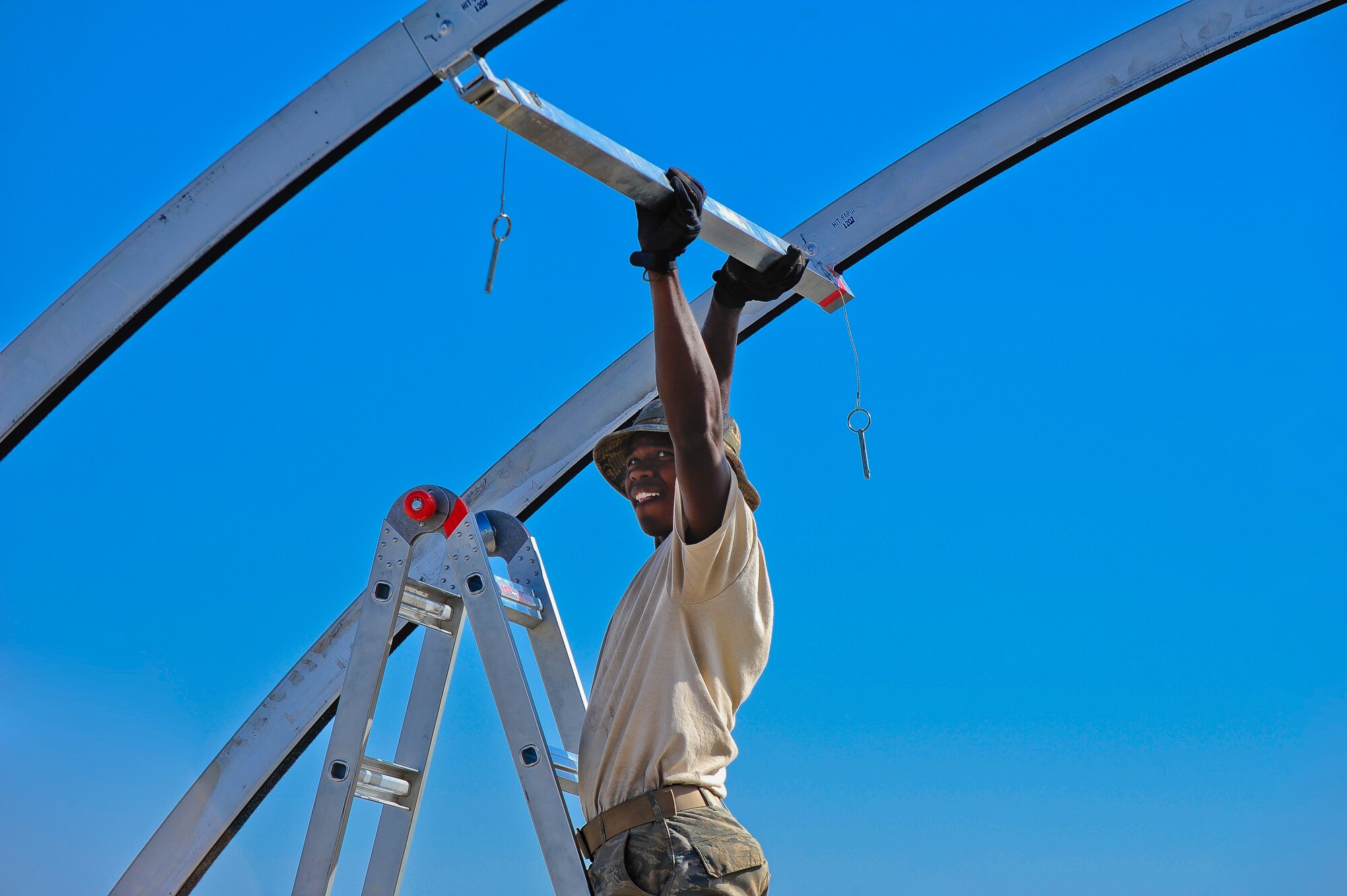 Senior Airman Masroy Plowright, 435th Construction Training Squadron heavy equipment operator, constructs a shelter Sept. 23, 2015, at Diyarbakir Air Base, Turkey. U.S. Air Forces Central Command has begun staging small detachments of aircraft and airmen at Diyarbakir Air Base in southeast Turkey to enhance Coalition capabilities to support personnel recovery operations in Syria and Iraq. Diyarbakir Air Base is a Turkish base home to the Turkish air force's 8th Air Wing. (U.S. Air Force photo by Airman Cory W. Bush/Released) 