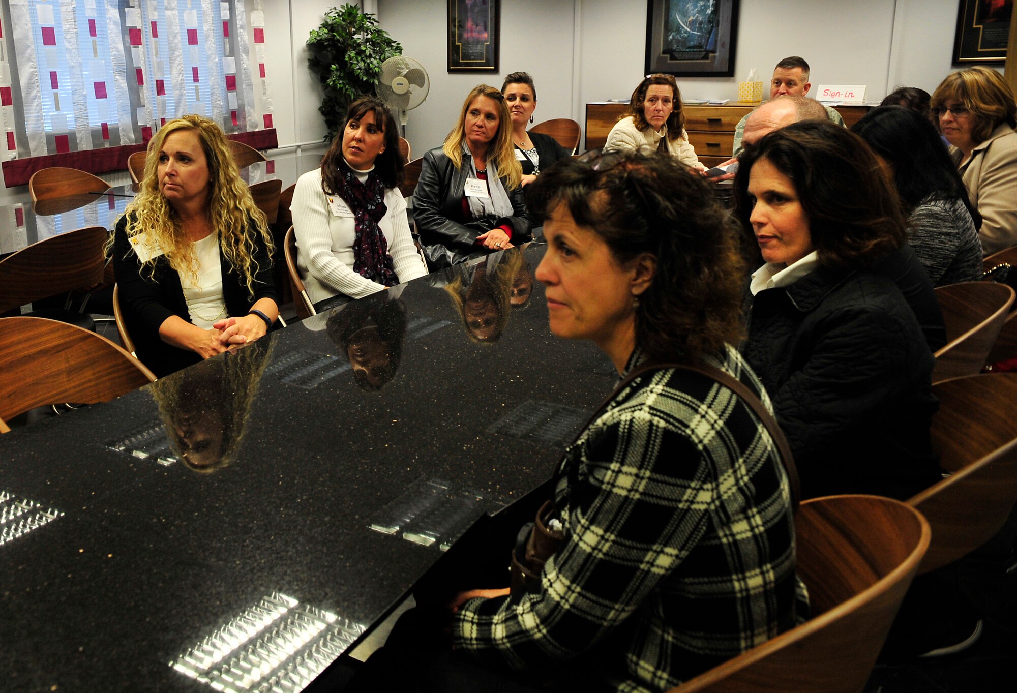 Team Ramstein leaders’ spouses listen to a briefing at the Airman and Family Readiness Center during an immersion tour Oct. 7, 2015, at Ramstein Air Base, Germany. The briefers spoke to the spouses about the classes and assistance they offer to military members, their dependents and civilians such as resume building and financial budgeting. (U.S. Air Force photo/Airman 1st Class Larissa Greatwood)